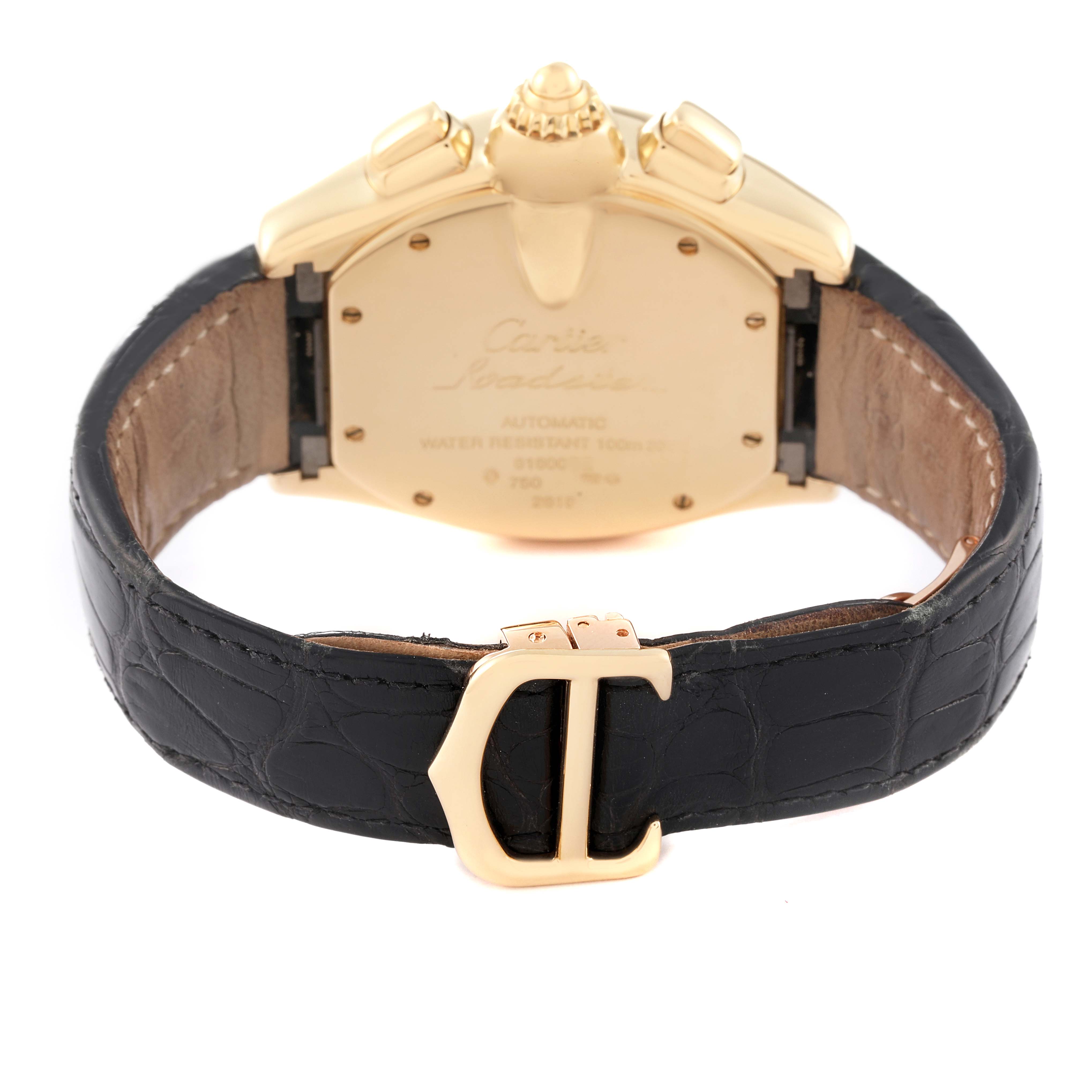 The image shows the back view of a Cartier Roadster W62021Y3 Men's Yellow Gold Silver Dial W62021Y3 Men's Yellow Gold Silver Dial watch, highlighting its case back, leather strap, and clasp.