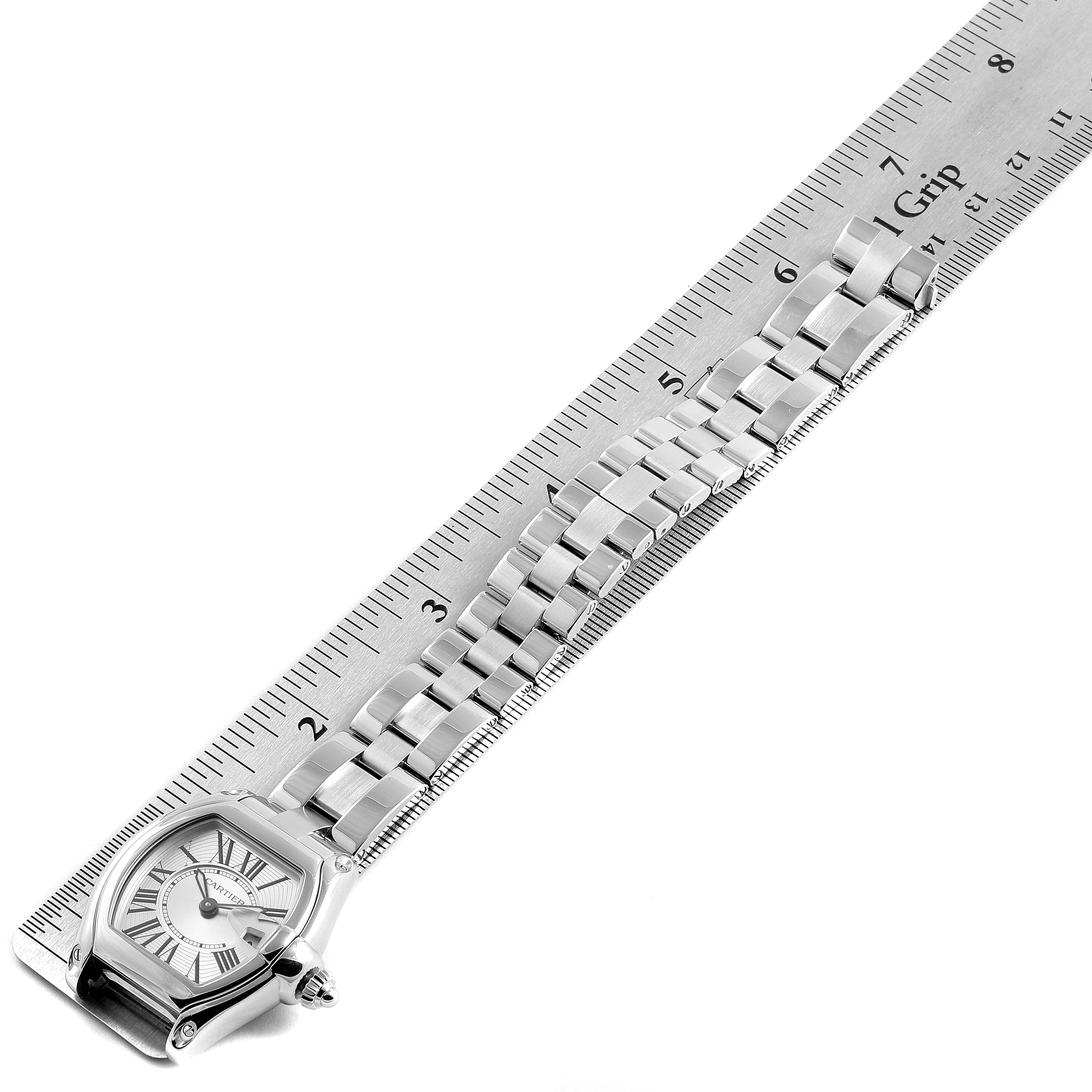 The image shows a Cartier Roadster W62016V3 Women's Stainless Steel Silver Dial W62016V3 Women's Stainless Steel Silver Dial watch laid next to a ruler for measurement, displaying the face and bracelet.