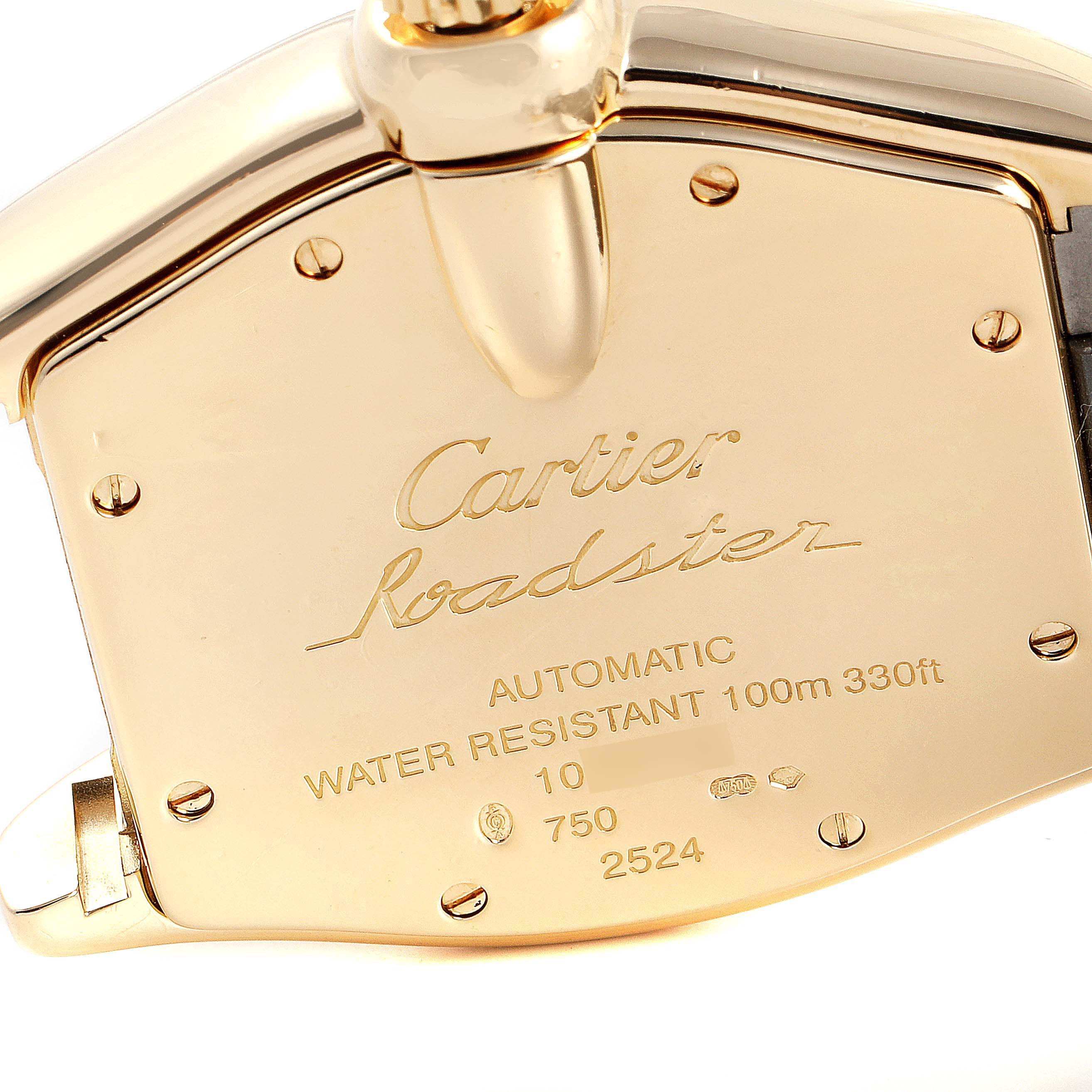 The image shows the back case of a Cartier Roadster W62005V2 Men's Yellow Gold Silver Dial W62005V2 Men's Yellow Gold Silver Dial watch, highlighting its engravings and details.