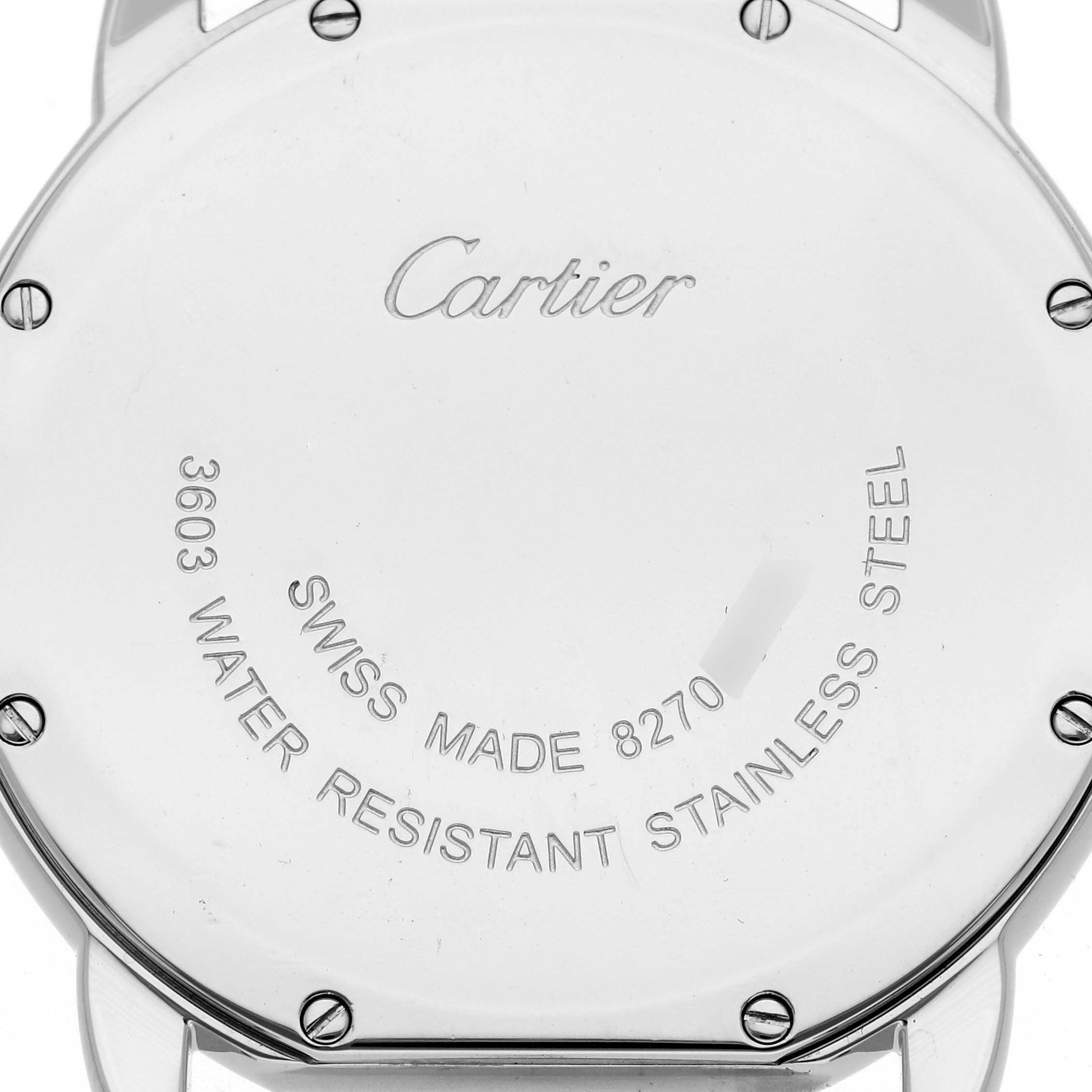 The image shows the back casing of the Cartier Ronde W6701005 Men
s Stainless Steel Silver Dial W6701005 Men
s Stainless Steel Silver Dial watch, highlighting its engraved details and stainless steel screws.