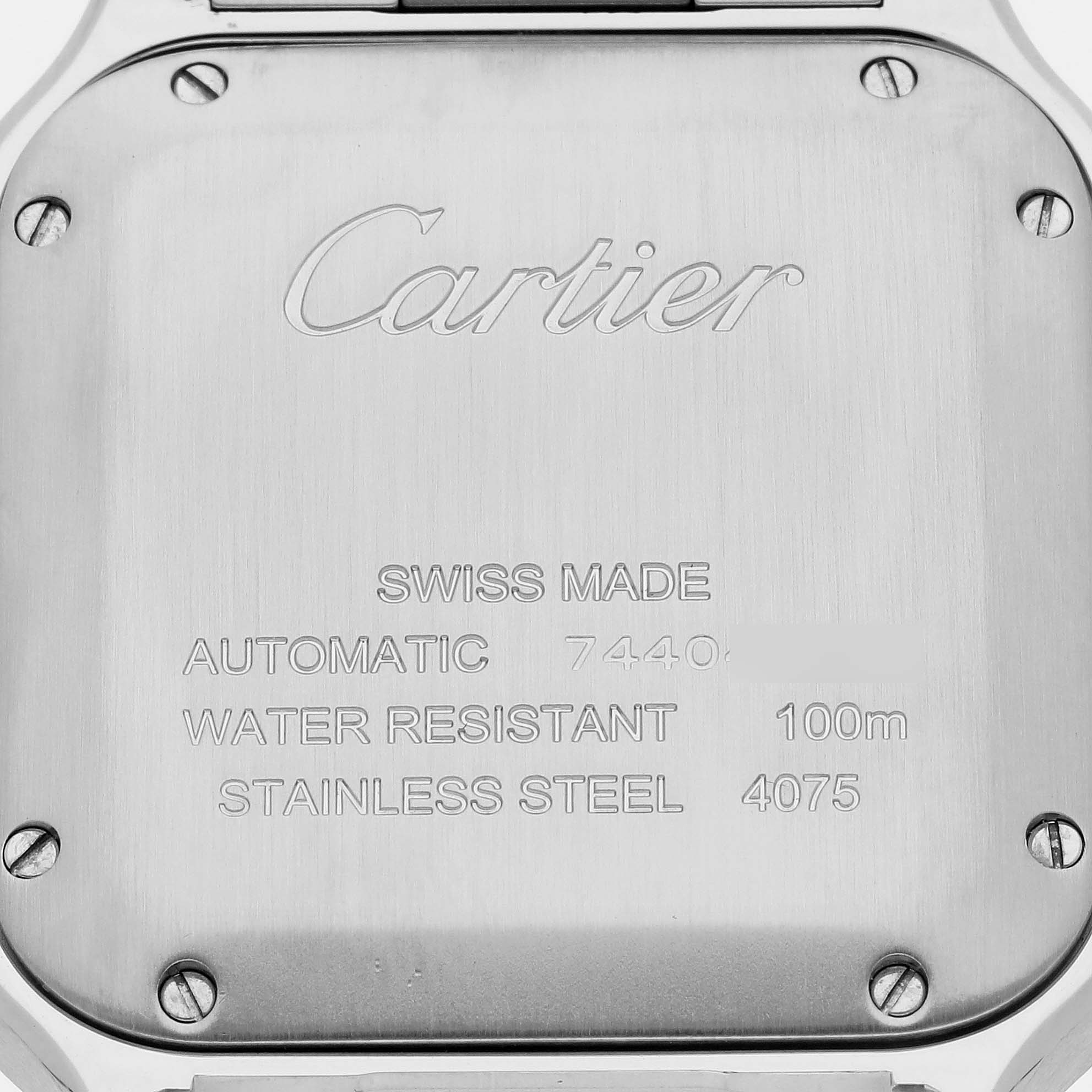 The image shows the back of the Cartier Santos WSSA0010 Men's Stainless Steel Silver Dial WSSA0010 Men's Stainless Steel Silver Dial watch, highlighting the brand and specifications.