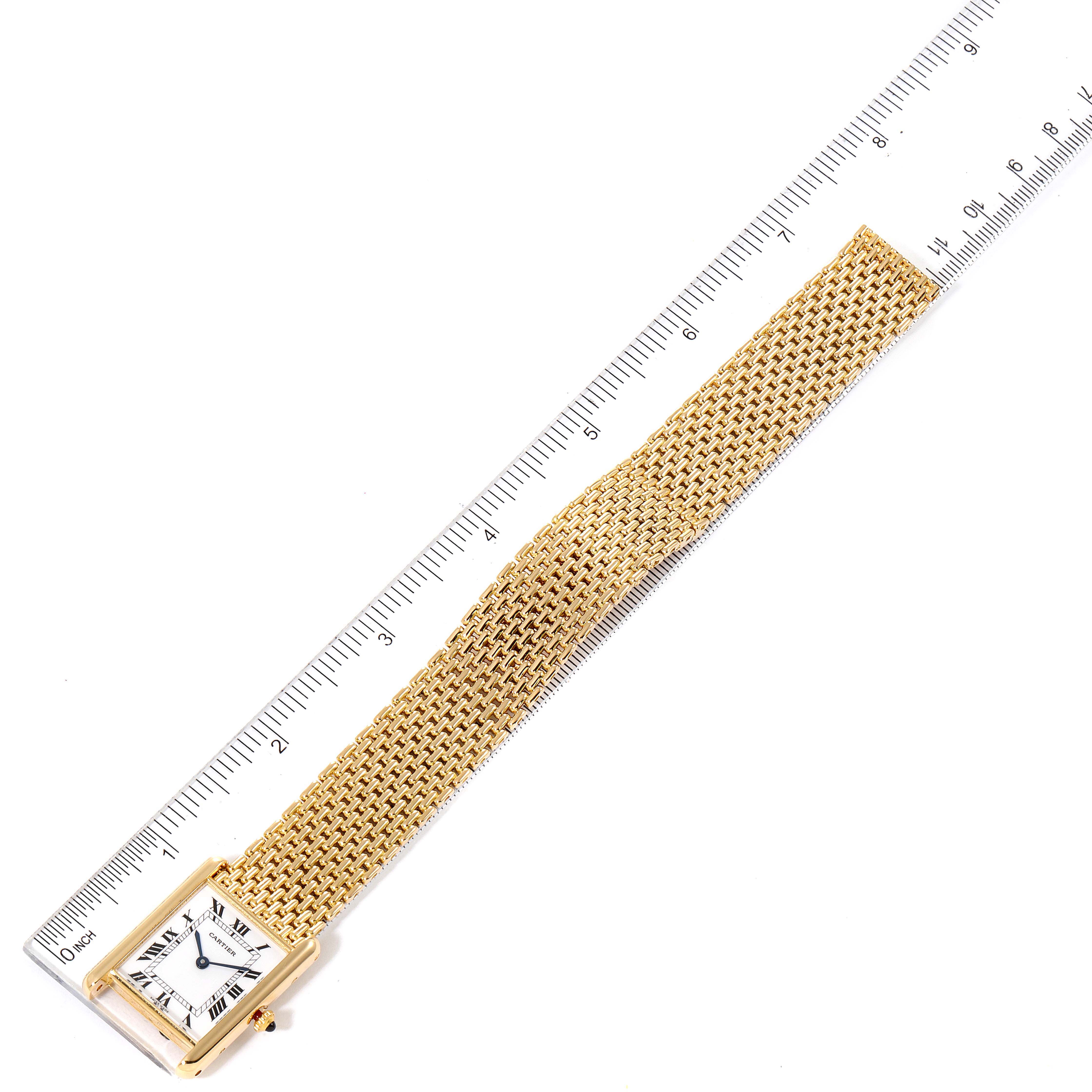 The Cartier Tank Classic Women's Yellow Gold White Dial Women's Yellow Gold White Dial watch is shown from a top-down angle with a measuring ruler for scale.