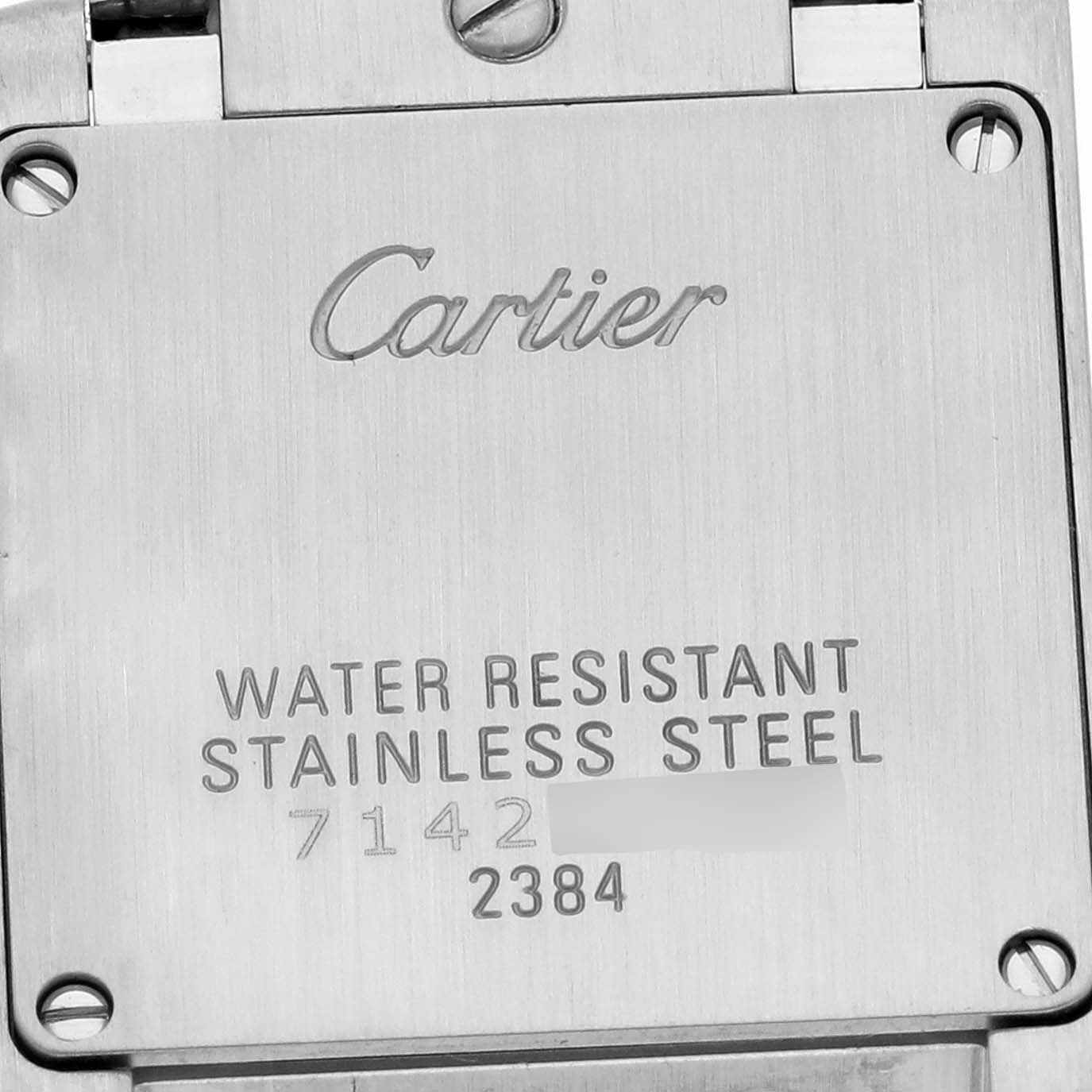 The image shows the back of a Cartier Tank Française watch, highlighting the stainless steel and water resistance markings.