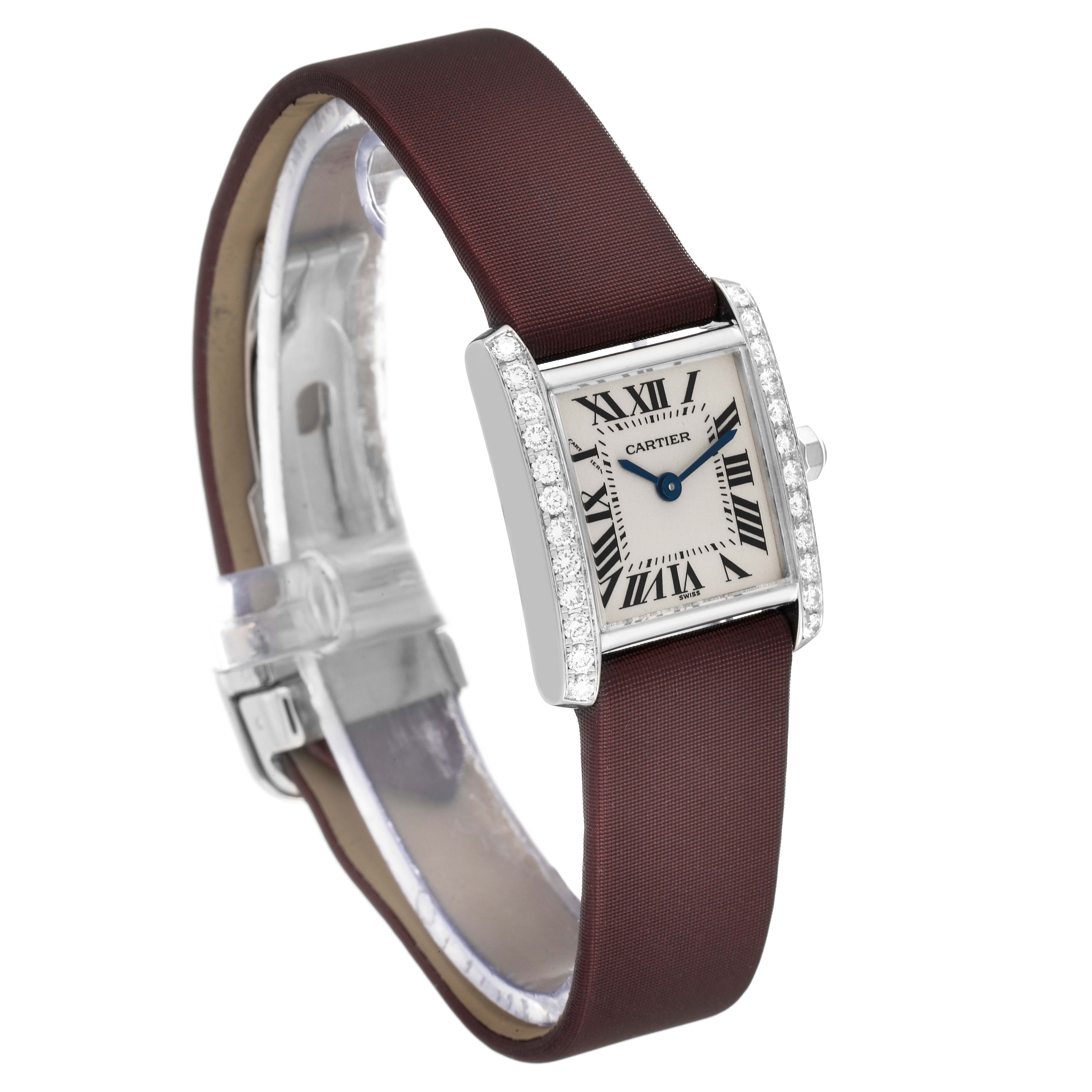 The Cartier Tank Francaise WE100251 Women's White Gold Silver Dial WE100251 Women's White Gold Silver Dial watch is shown at a slight angle displaying the face, bezel with diamonds, and brown leather strap.