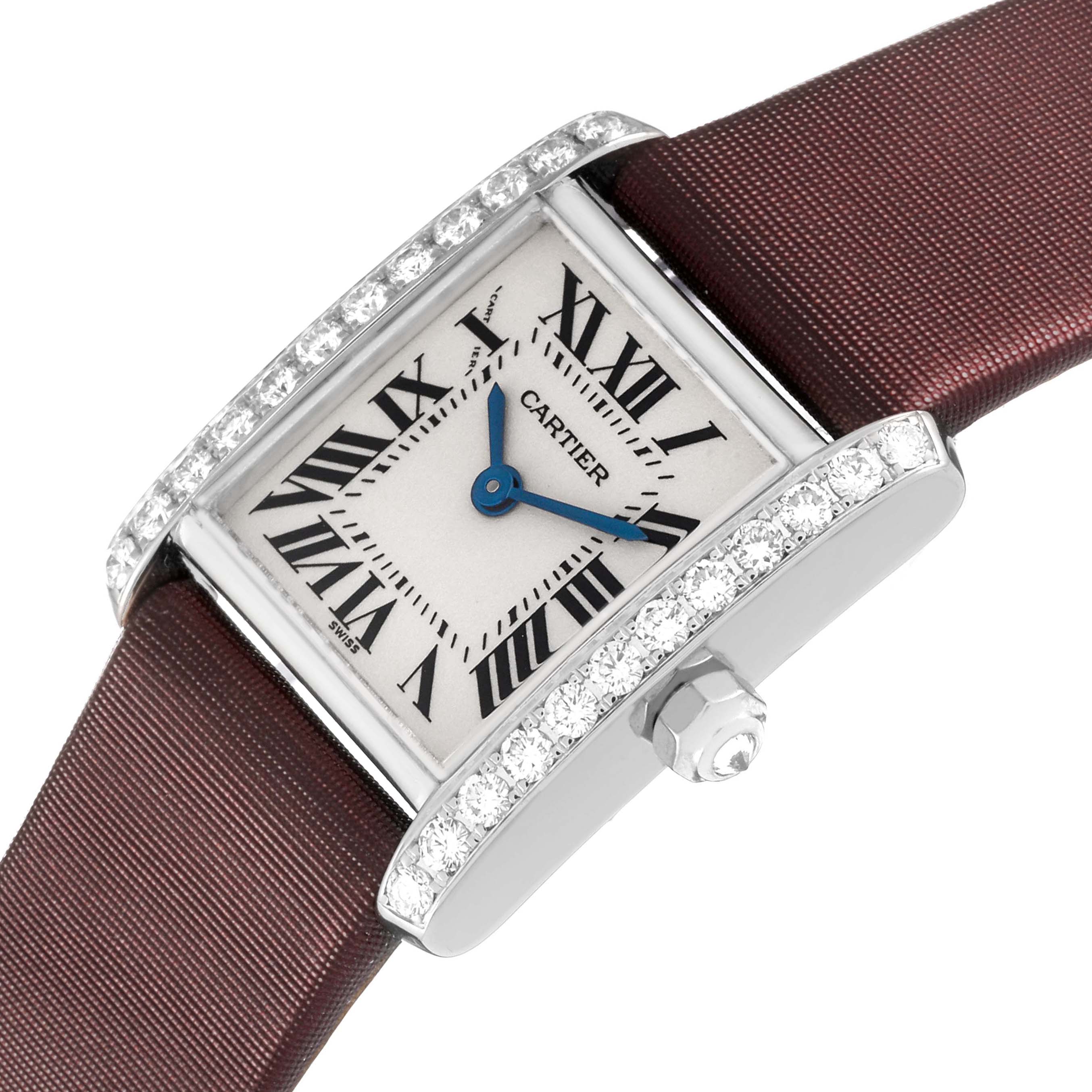 The Cartier Tank Française watch is shown at an angle highlighting its diamond-encrusted sides, crown, and maroon strap.