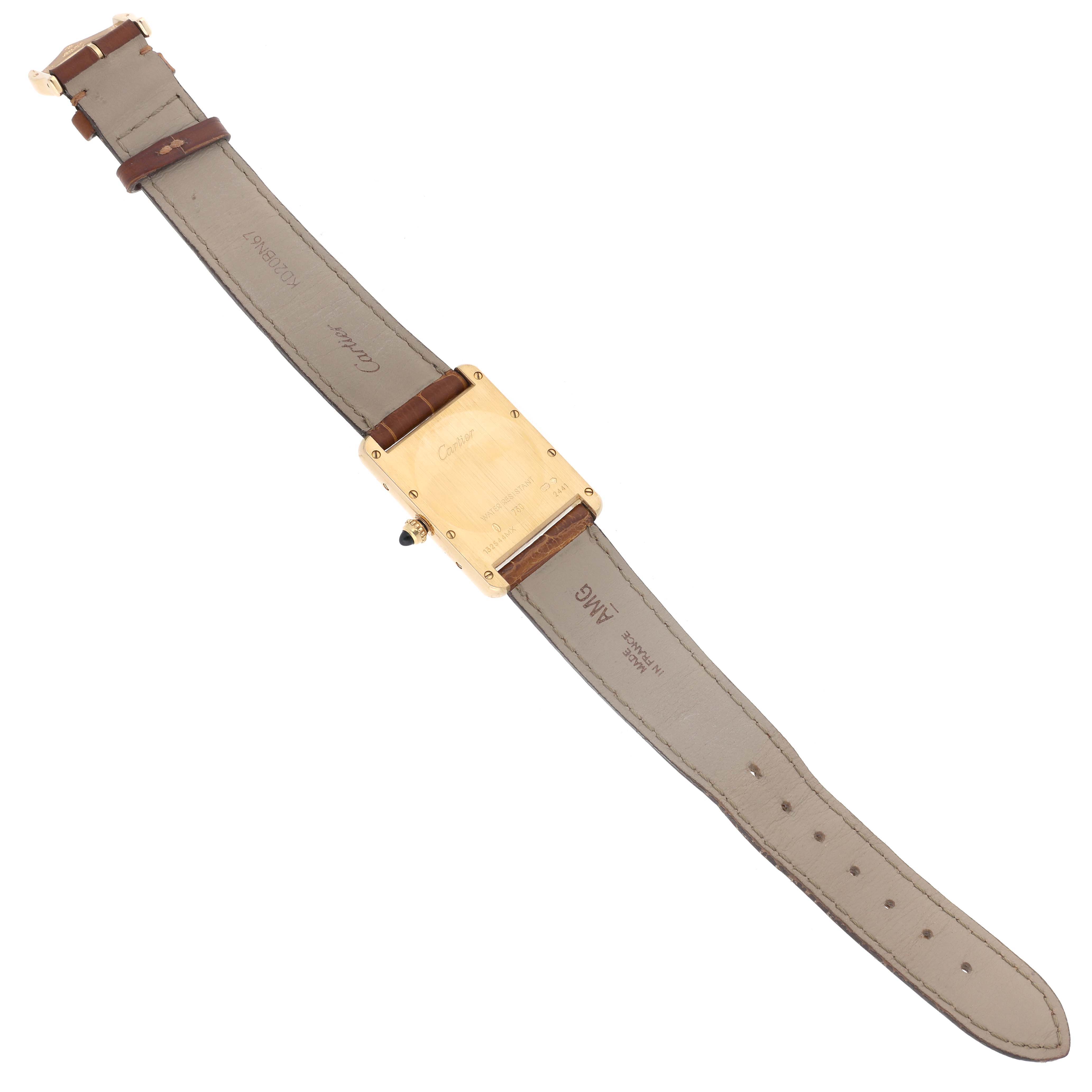 The Cartier Tank Louis W1529756 Men's Yellow Gold Silver Dial W1529756 Men's Yellow Gold Silver Dial watch is shown from the back view, displaying the case, strap, and buckle.