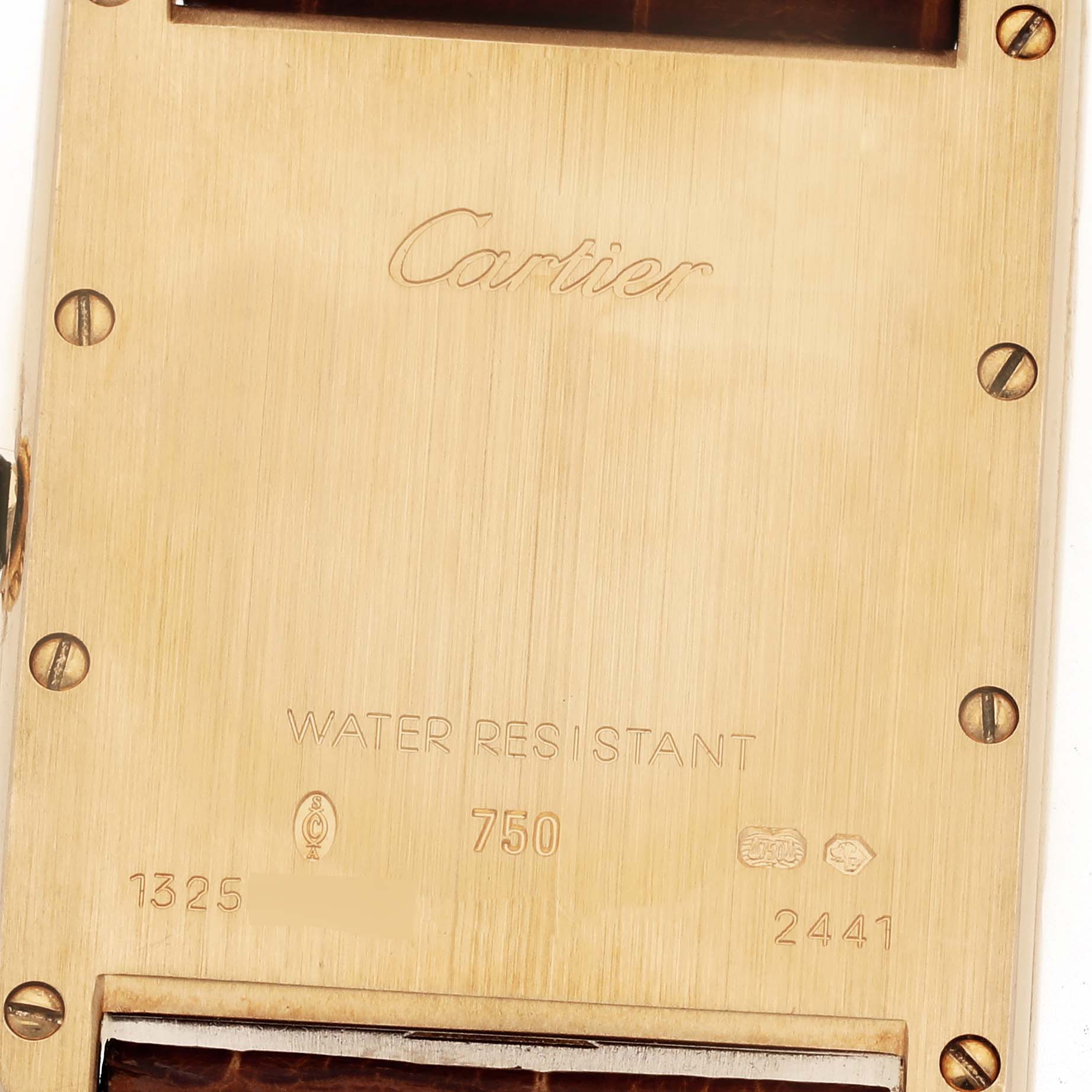 The image shows the back case of a Cartier Tank Louis W1529756 Men's Yellow Gold Silver Dial W1529756 Men's Yellow Gold Silver Dial watch, featuring inscriptions and screws.