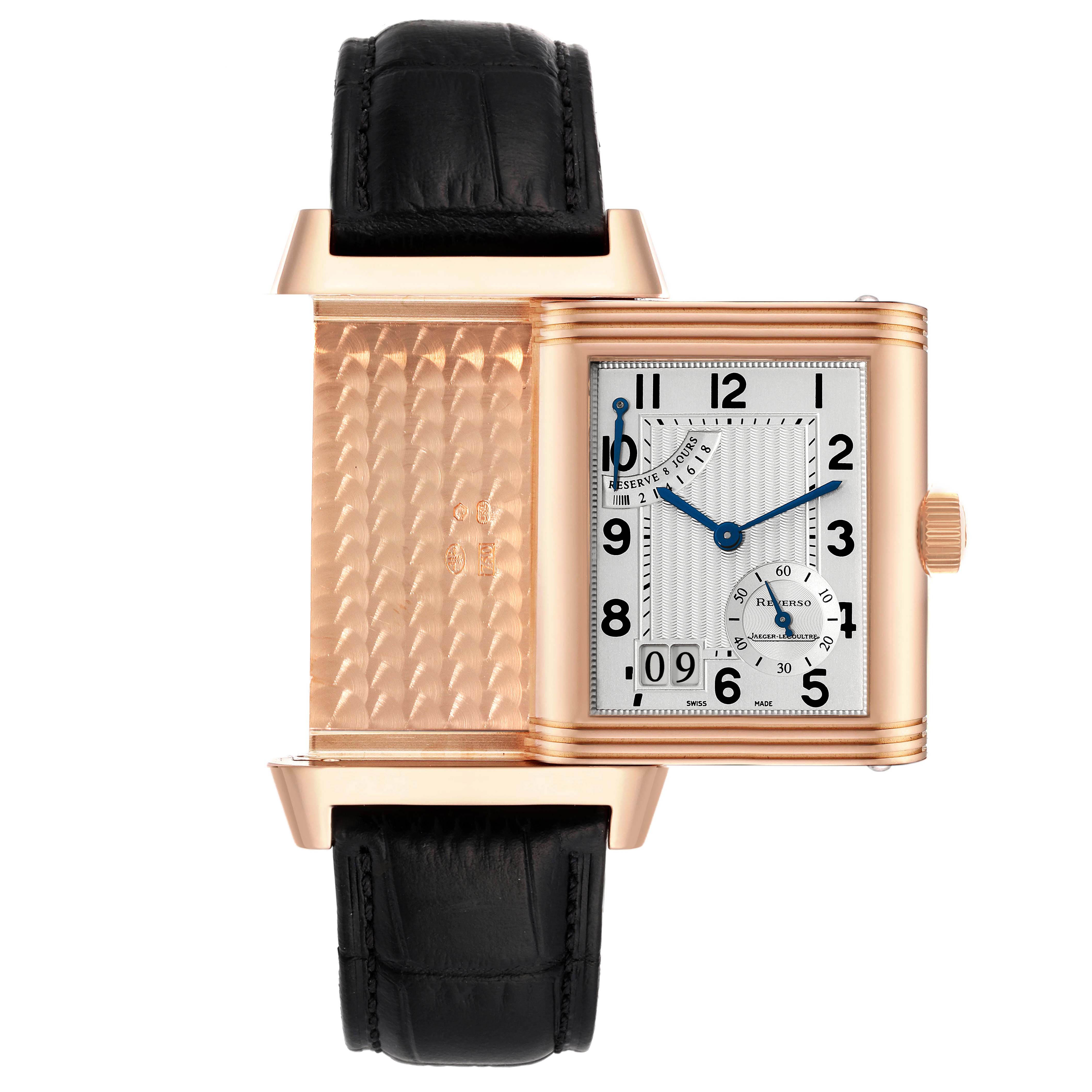 This image shows the Jaeger LeCoultre Reverso Q3002401 Men's Rose Gold Silver Dial Q3002401 Men's Rose Gold Silver Dial watch partially rotated, revealing the back panel and front dial with the black leather strap.