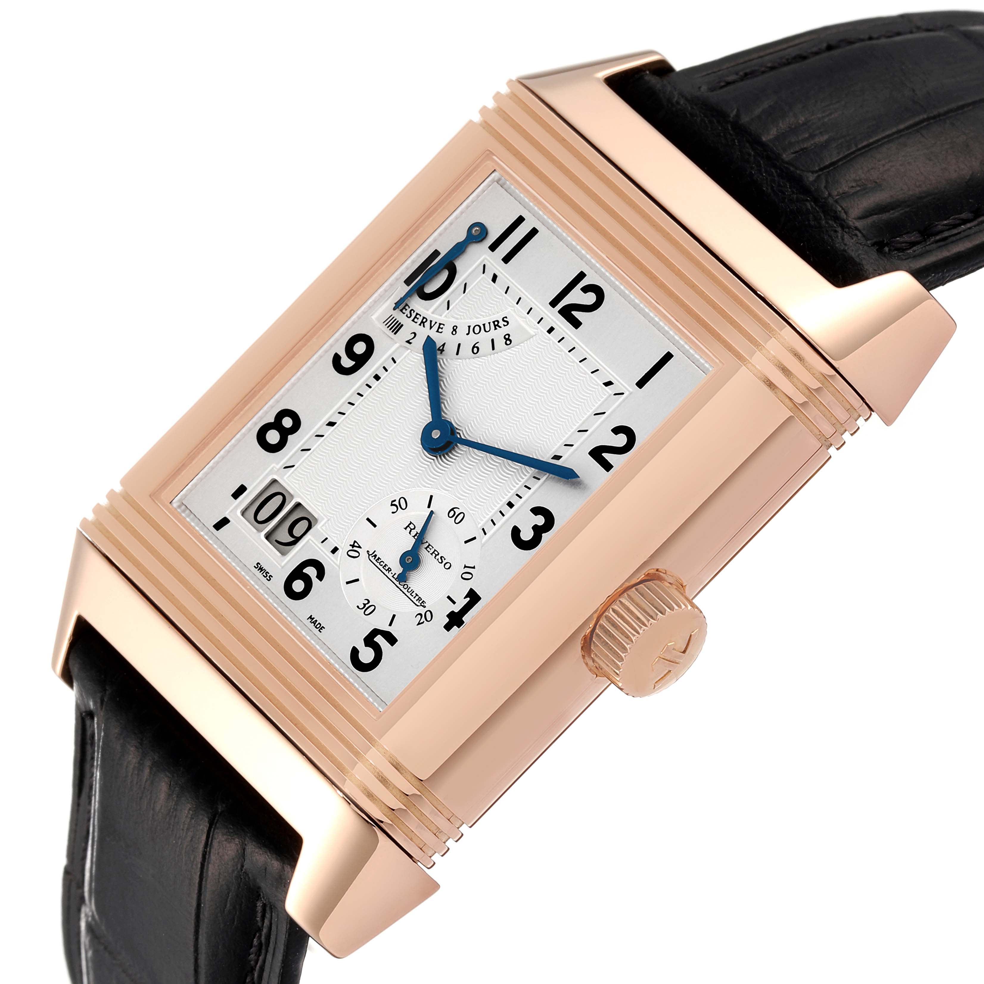 This angled image of the Jaeger-LeCoultre Reverso watch shows the dial, crown, case, and part of the leather strap.