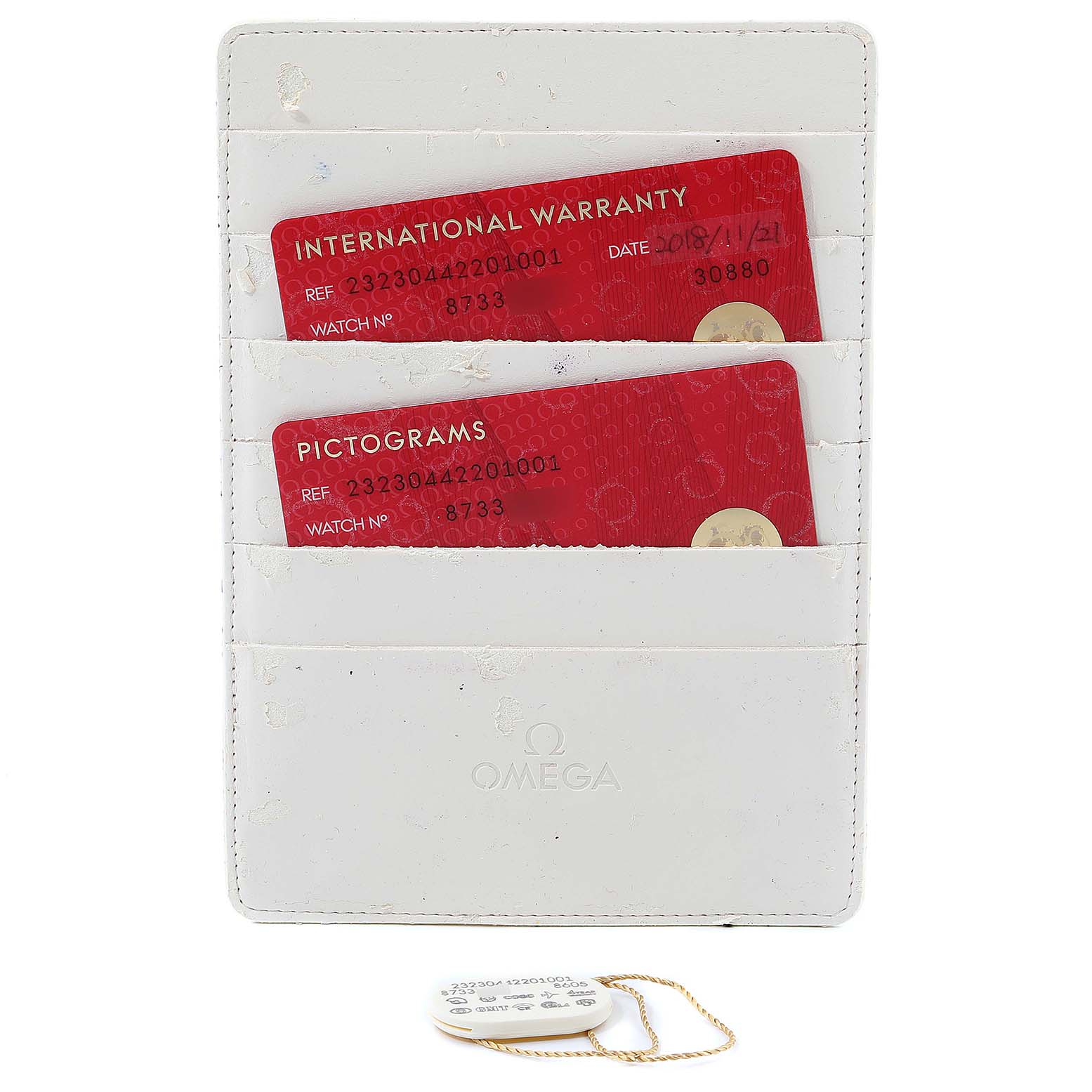 This image shows the warranty cards and tags for the Omega Planet Ocean 232.30.44.22.01.001 Men
s Stainless Steel Black Dial 232.30.44.22.01.001 Men
s Stainless Steel Black Dial model, displayed in a white cardholder.