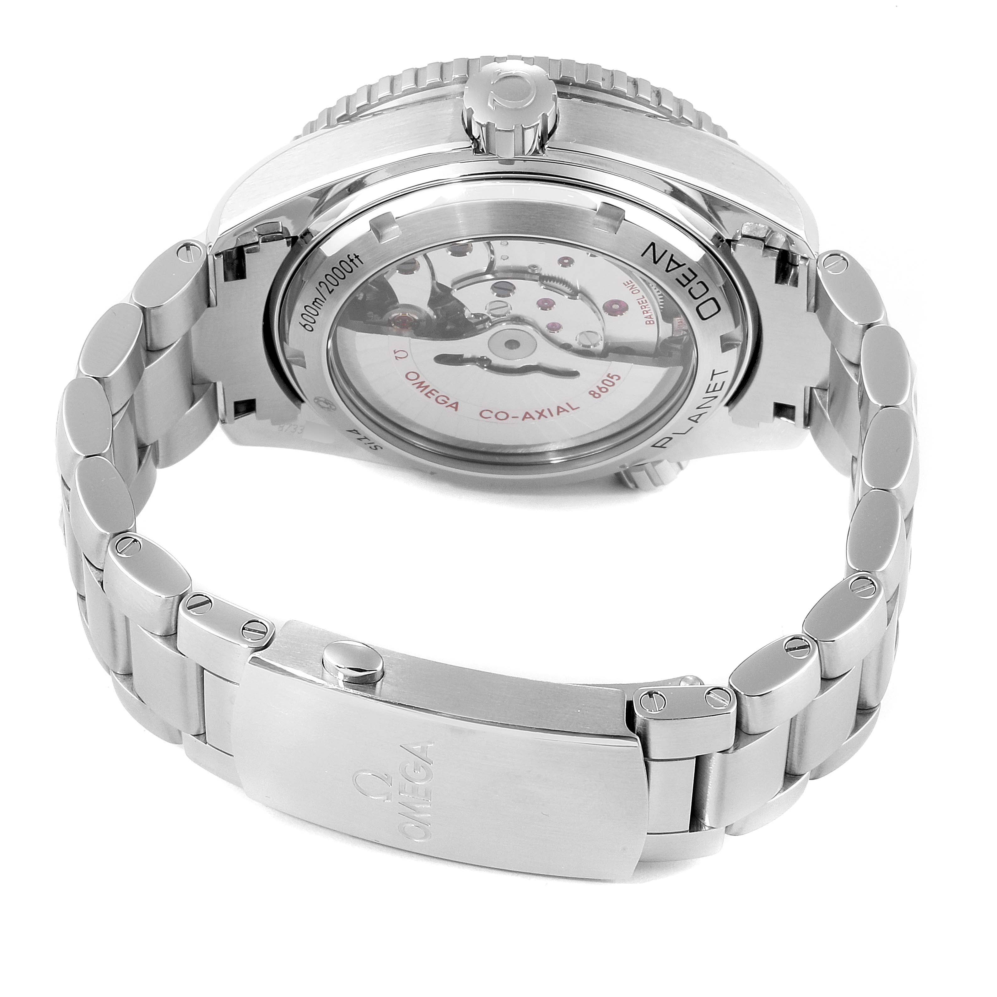 The Omega Planet Ocean 232.30.44.22.01.001 Men
s Stainless Steel Black Dial 232.30.44.22.01.001 Men
s Stainless Steel Black Dial watch is shown from the back, displaying its transparent case back, mechanism, and metal bracelet.