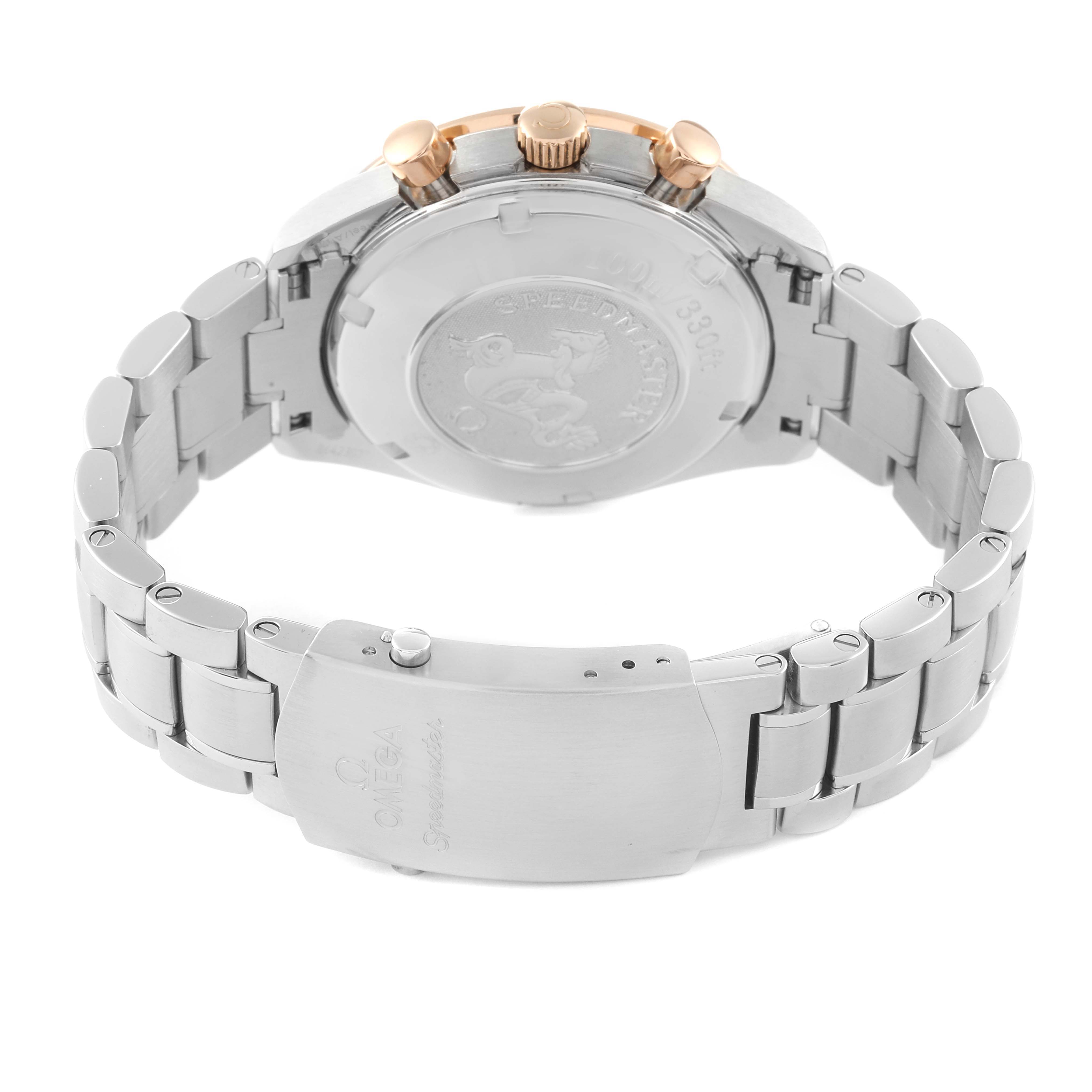 The Omega Speedmaster 323.21.40.40.01.001 Men's Steel and Gold (two tone) Black Dial 323.21.40.40.01.001 Men's Steel and Gold (two tone) Black Dial watch is displayed from the reverse angle, showing its case back, pushers, crown, and stainless steel bracelet.