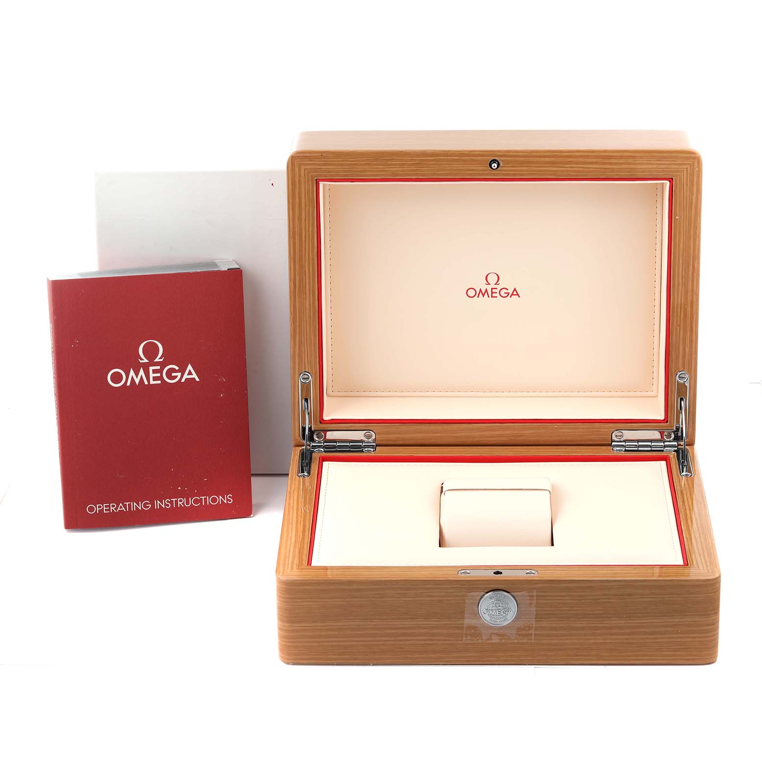 The image shows the open wooden box and manual of an Omega Speedmaster 3539.31.00 Men
s Stainless Steel Silver Dial 3539.31.00 Men
s Stainless Steel Silver Dial watch, viewed from the front.
