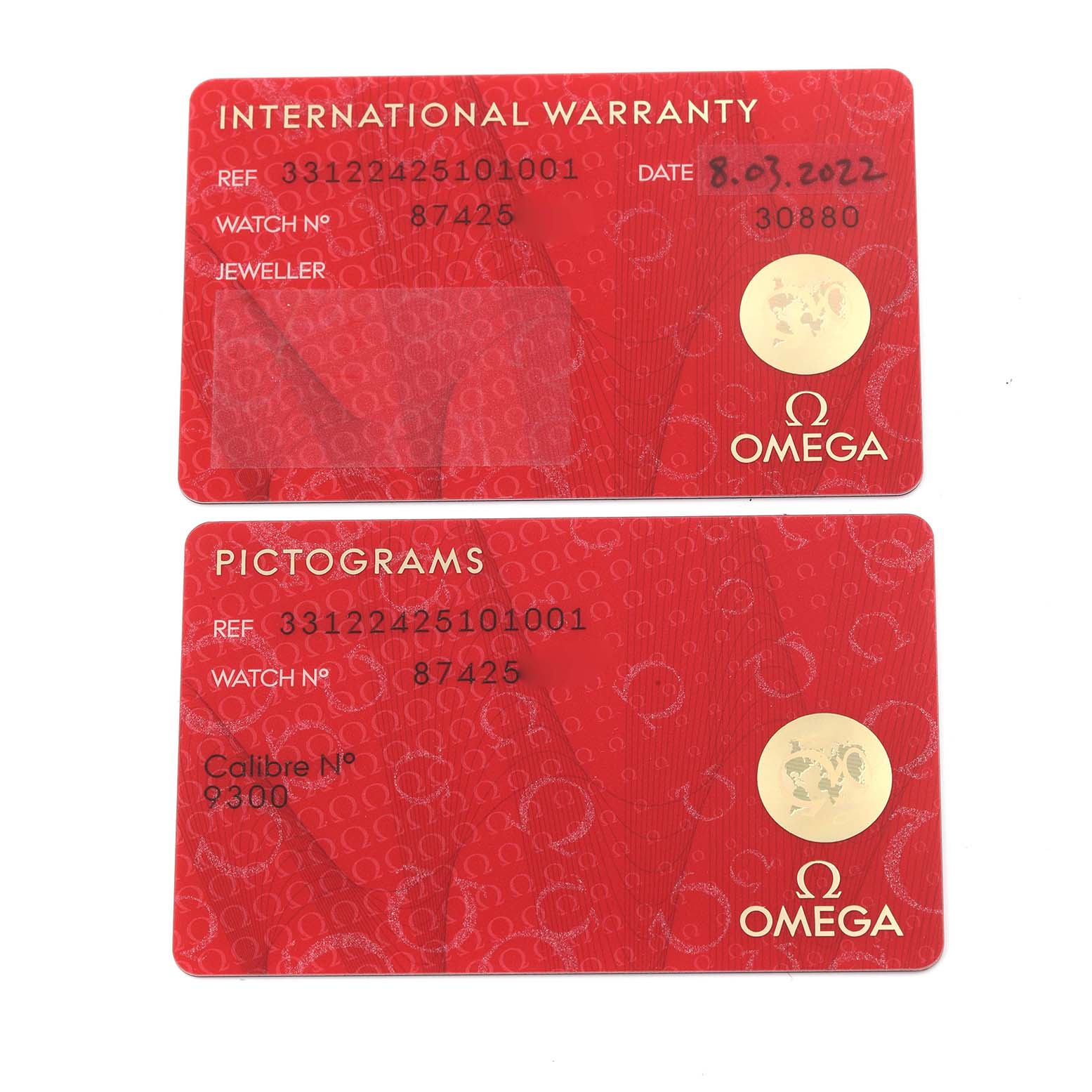 The image shows two red Omega Speedmaster 331.22.42.51.01.001 Men's Steel and Gold (two tone) Black Dial 331.22.42.51.01.001 Men's Steel and Gold (two tone) Black Dial warranty cards, one labeled "International Warranty" and the other "Pictograms."