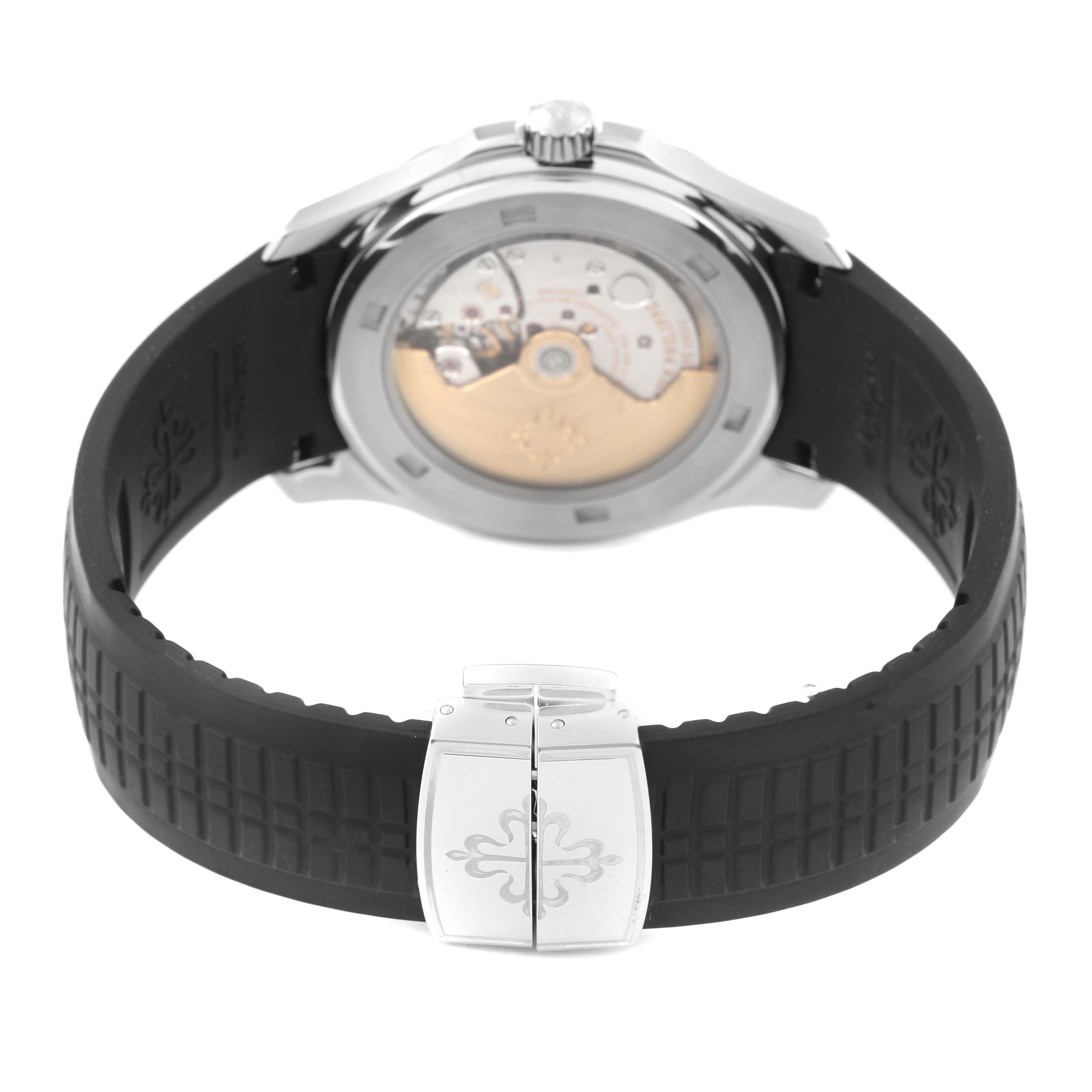 The image shows the Patek Philippe Aquanaut 5165A-001 Men's Stainless Steel Grey Dial 5165A-001 Men's Stainless Steel Grey Dial from the back, highlighting the movement and black rubber strap.