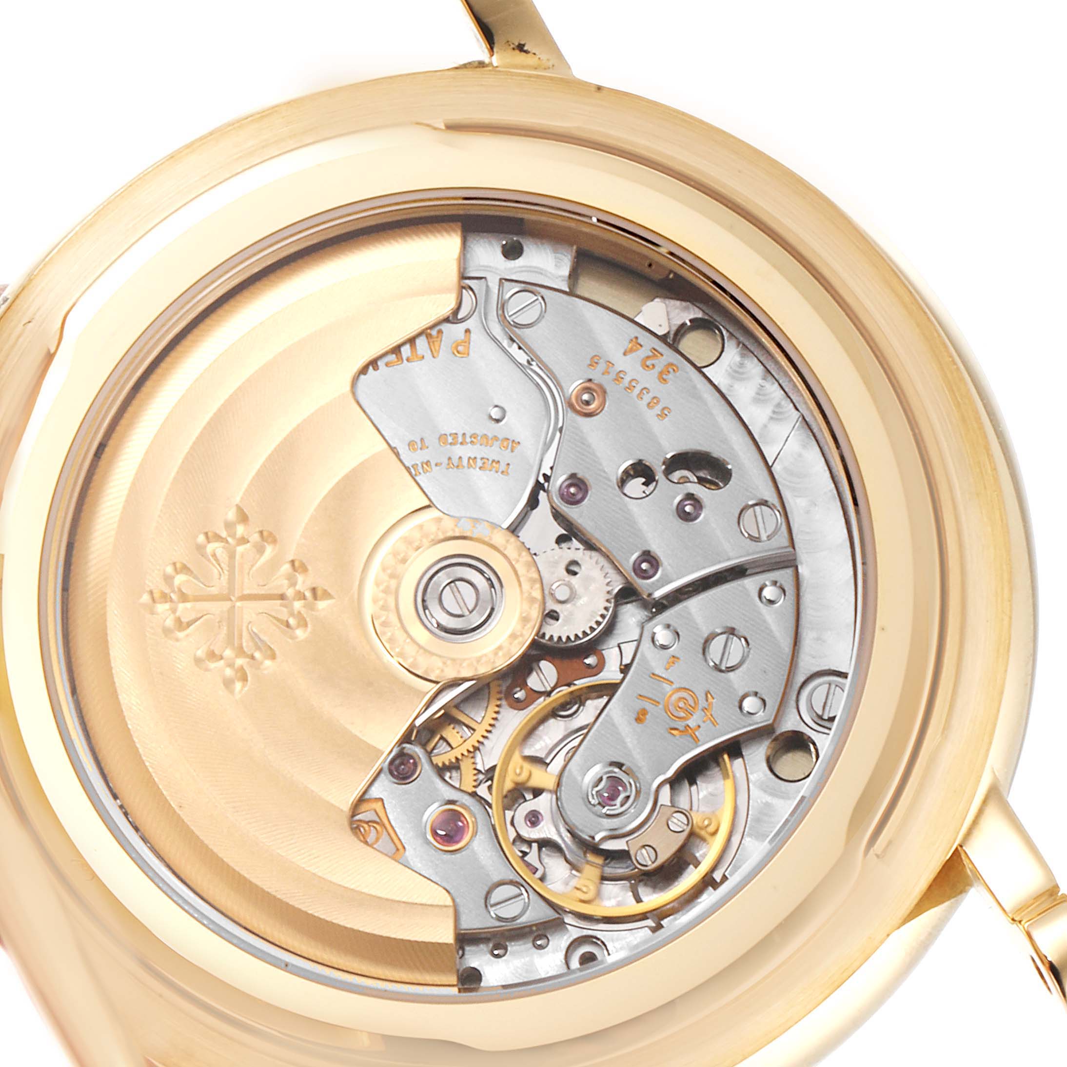The image shows the intricate movement of a Patek Philippe Calatrava 5153J Men's Yellow Gold Silver Dial 5153J Men's Yellow Gold Silver Dial watch from a close and top angle.