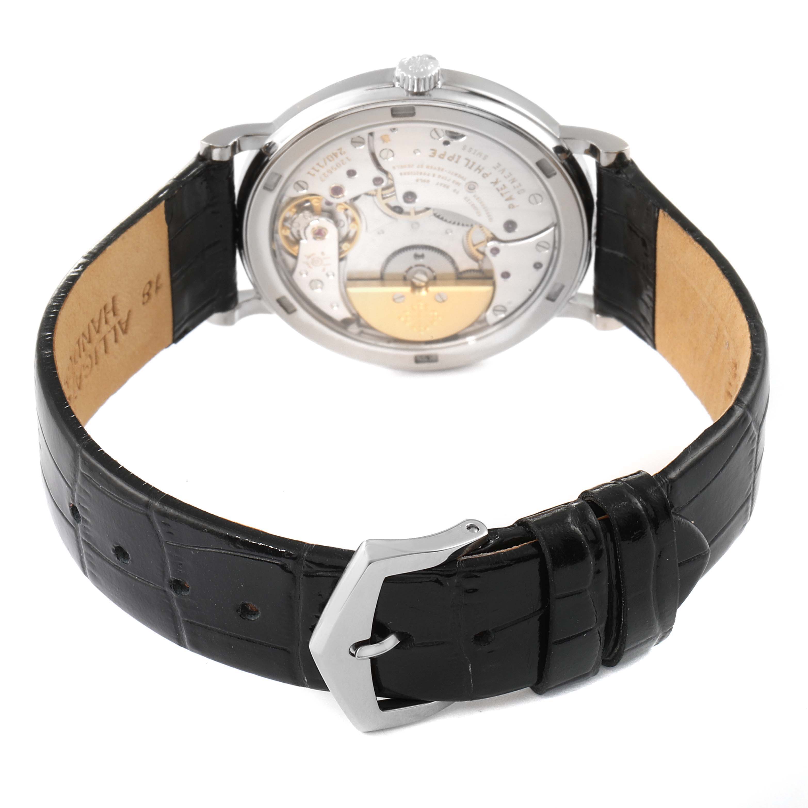 The image shows the back of the Patek Philippe Calatrava 5120G Men's White Gold White Dial 5120G Men's White Gold White Dial watch, highlighting the movement and black leather strap.