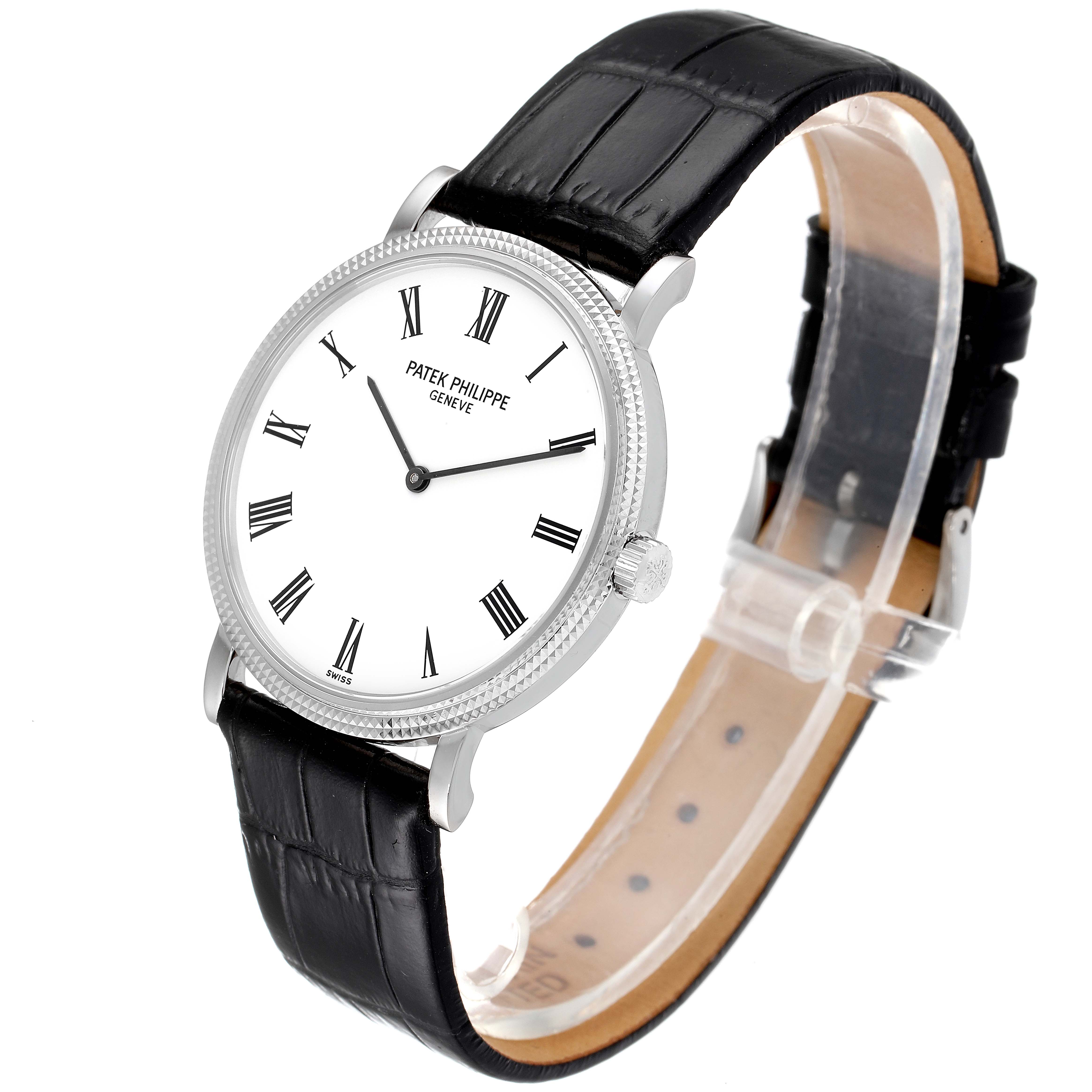 This image shows a Patek Philippe Calatrava 5120G Men's White Gold White Dial 5120G Men's White Gold White Dial watch at a slight angle, highlighting its white dial, black leather strap, and Roman numerals.