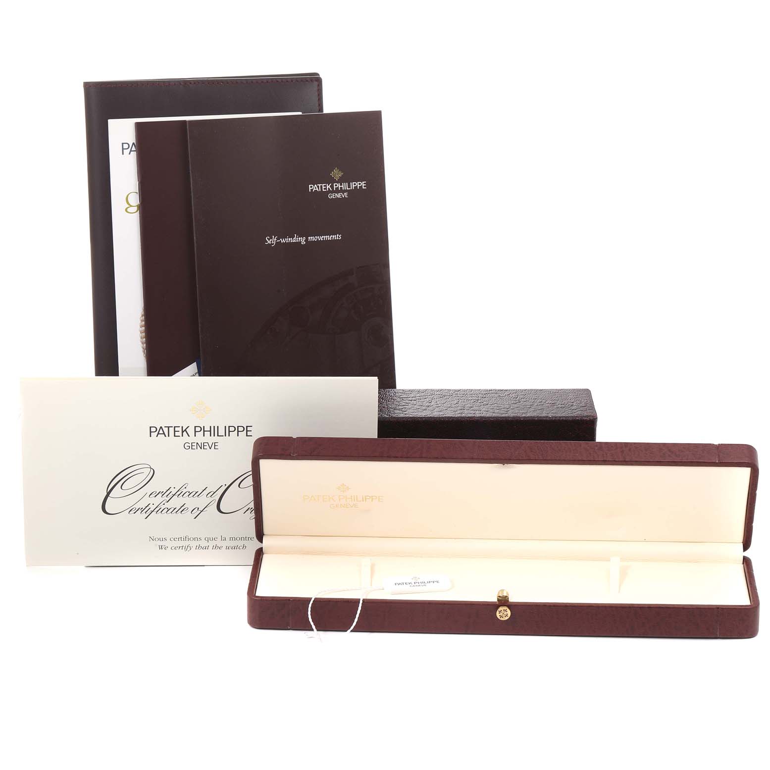 The image displays the packaging and certificates for the Patek Philippe Calatrava 5120G Men's White Gold White Dial 5120G Men's White Gold White Dial watch, without the watch itself.