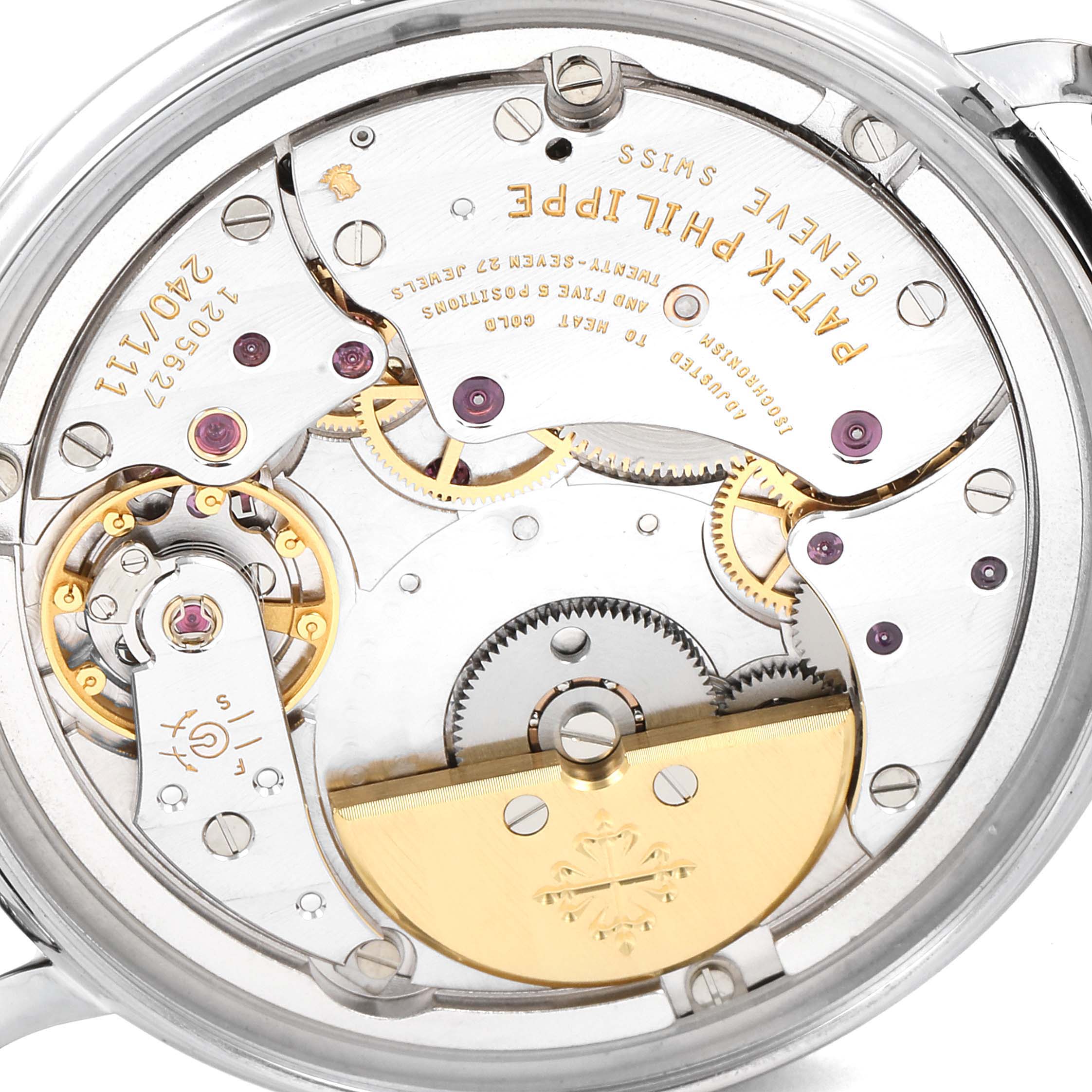 The image shows the back view of a Patek Philippe Calatrava 5120G Men's White Gold White Dial 5120G Men's White Gold White Dial watch, revealing its intricate mechanical movement.
