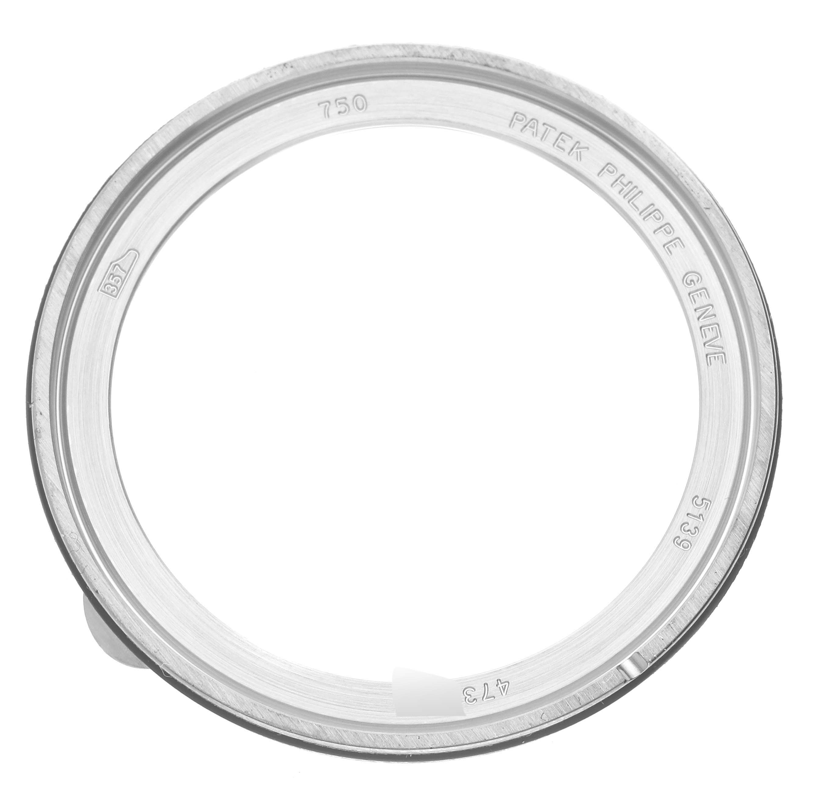 The image shows a Patek Philippe Complications 5139G-001 Men's White Gold Grey Dial 5139G-001 Men's White Gold Grey Dial watch bezel, viewed from a top-down angle.