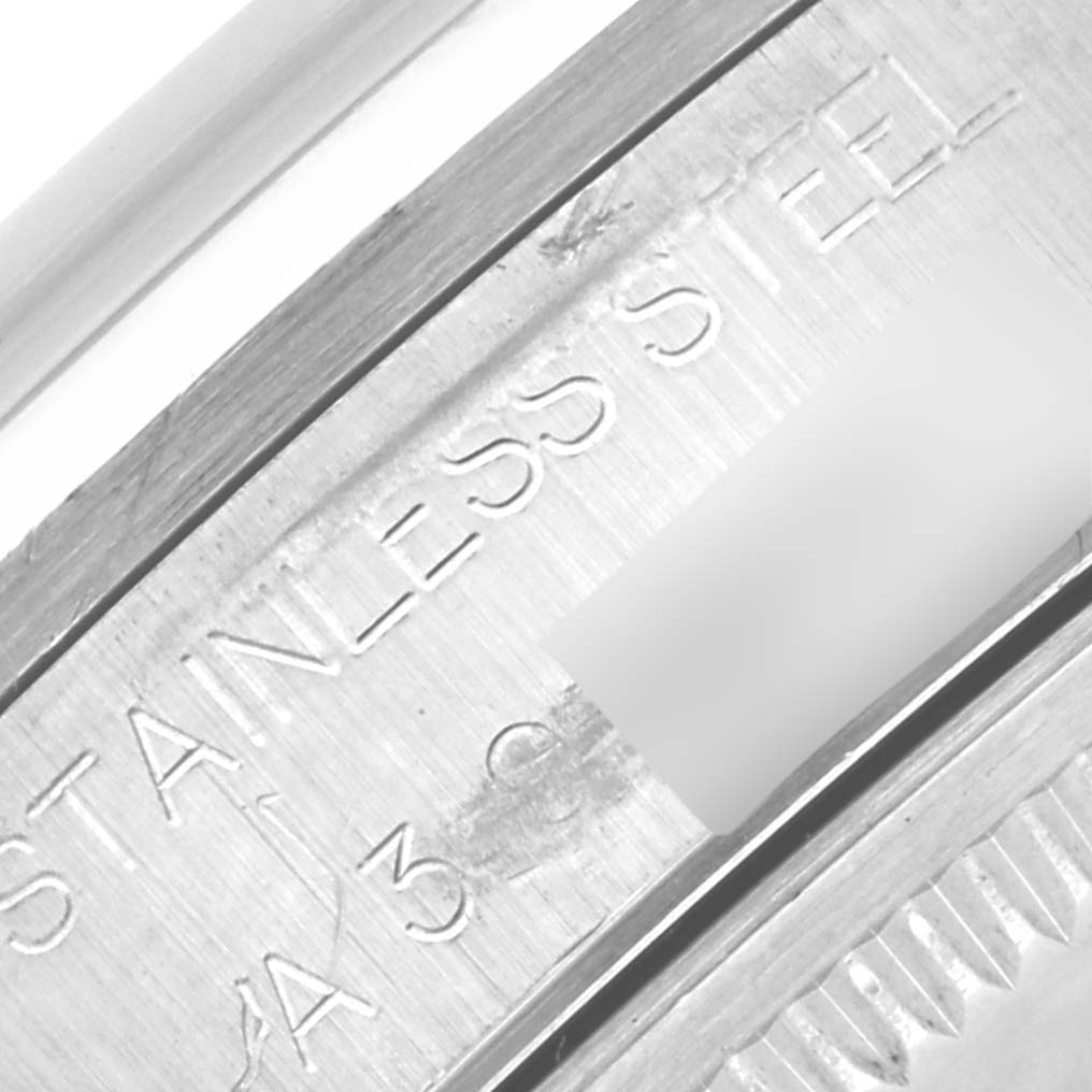 The image shows a close-up of the Rolex Air-King 14000 Men's Stainless Steel Pink Dial 14000 Men's Stainless Steel Pink Dial's stainless steel engraving on the case back.