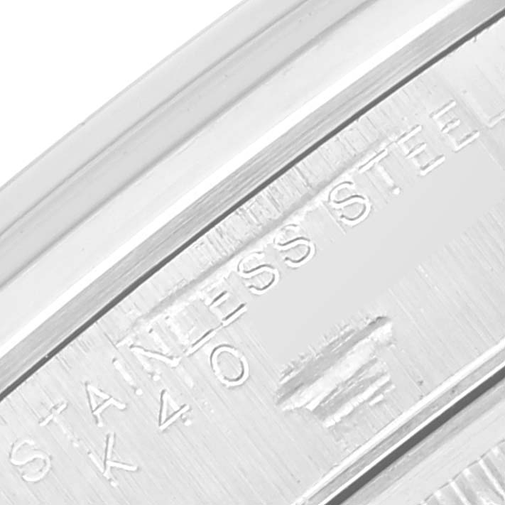 This close-up image shows the stainless steel engraving on the back of a Rolex Air-King 14000 Men's Stainless Steel Silver Dial 14000 Men's Stainless Steel Silver Dial watch.