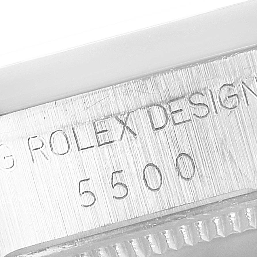 The image shows a close-up of the side engraving of a Rolex Vintage Collection 5500 Men's Stainless Steel Silver Dial 5500 Men's Stainless Steel Silver Dial model 5500.