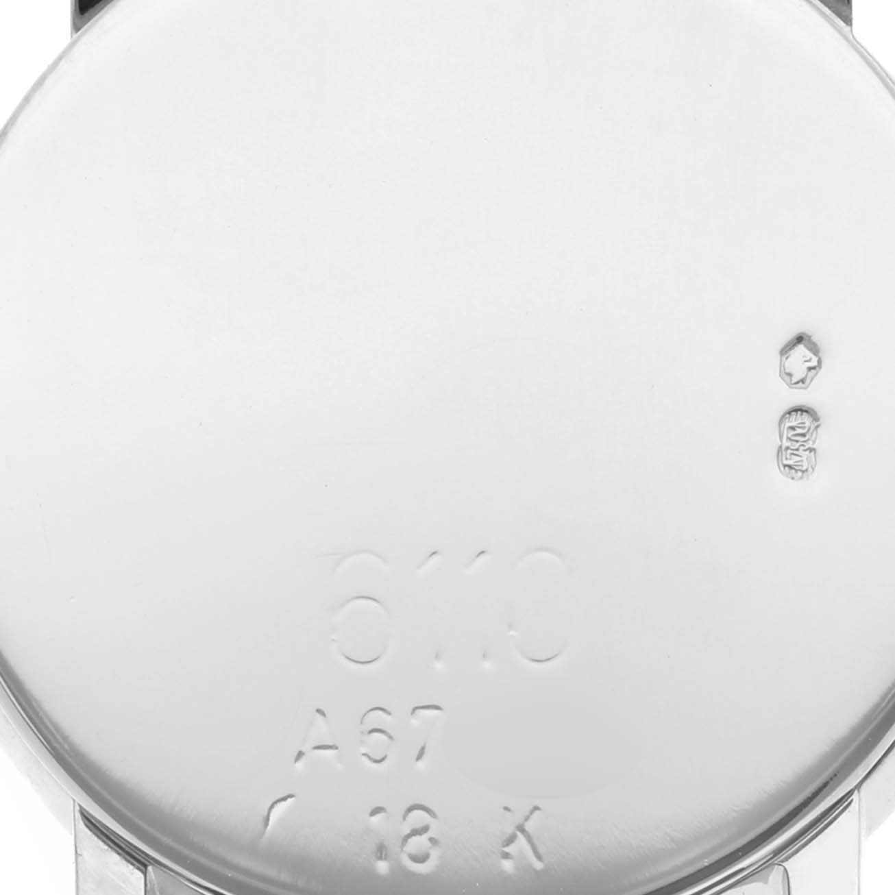 The image shows the back casing of a Rolex Cellini 6110 Women's White Gold Brown Dial 6110 Women's White Gold Brown Dial watch, highlighting engraved details.