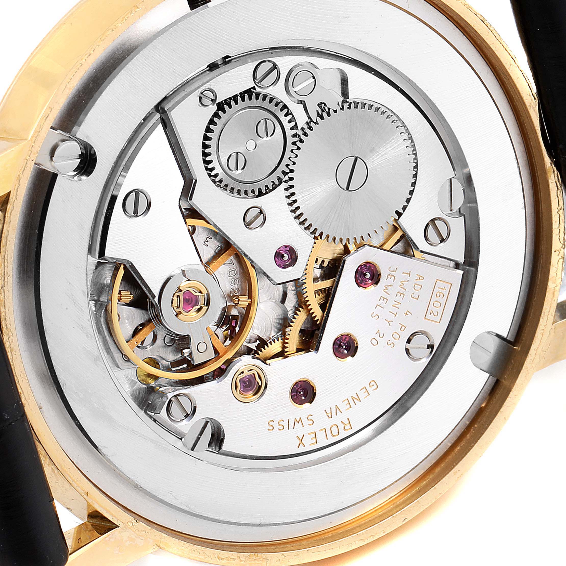 This image shows the inner mechanical movement of a Rolex Cellini 5115 Men's Yellow Gold Silver Dial 5115 Men's Yellow Gold Silver Dial watch from a close-up angle, displaying gears and components.