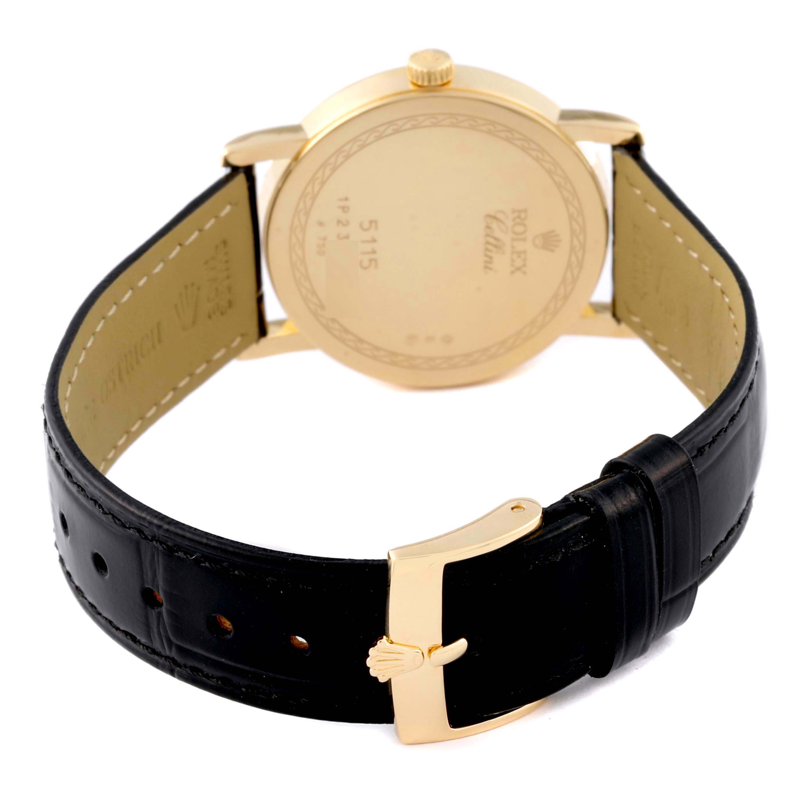 The image shows a Rolex Cellini 5115 Men's Yellow Gold Champagne Dial 5115 Men's Yellow Gold Champagne Dial watch from the rear angle, highlighting the back case, crown, and leather strap with a buckle.