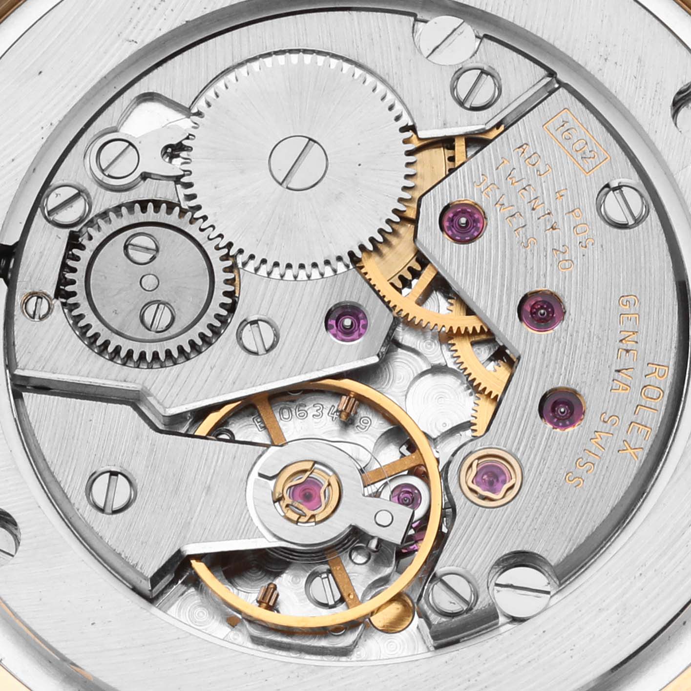 The image shows the intricate internal mechanism of the Rolex Cellini 5115 Men's Yellow Gold Champagne Dial 5115 Men's Yellow Gold Champagne Dial watch, highlighting its gears and movement.