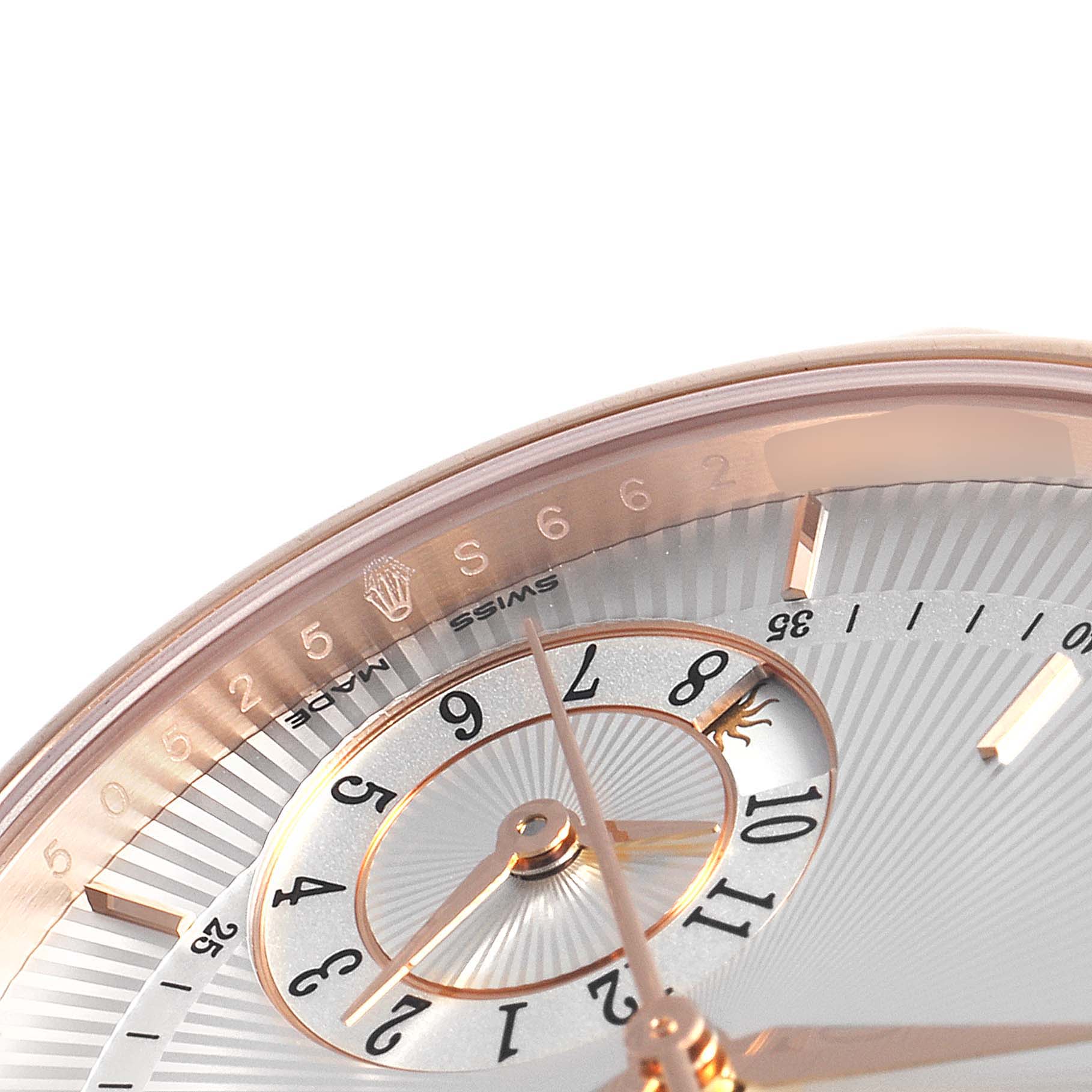 The image shows a close-up of the dial of a Rolex Cellini 50525 Men
s Rose Gold Silver Dial 50525 Men
s Rose Gold Silver Dial watch, highlighting the numbers, hands, and part of the bezel.