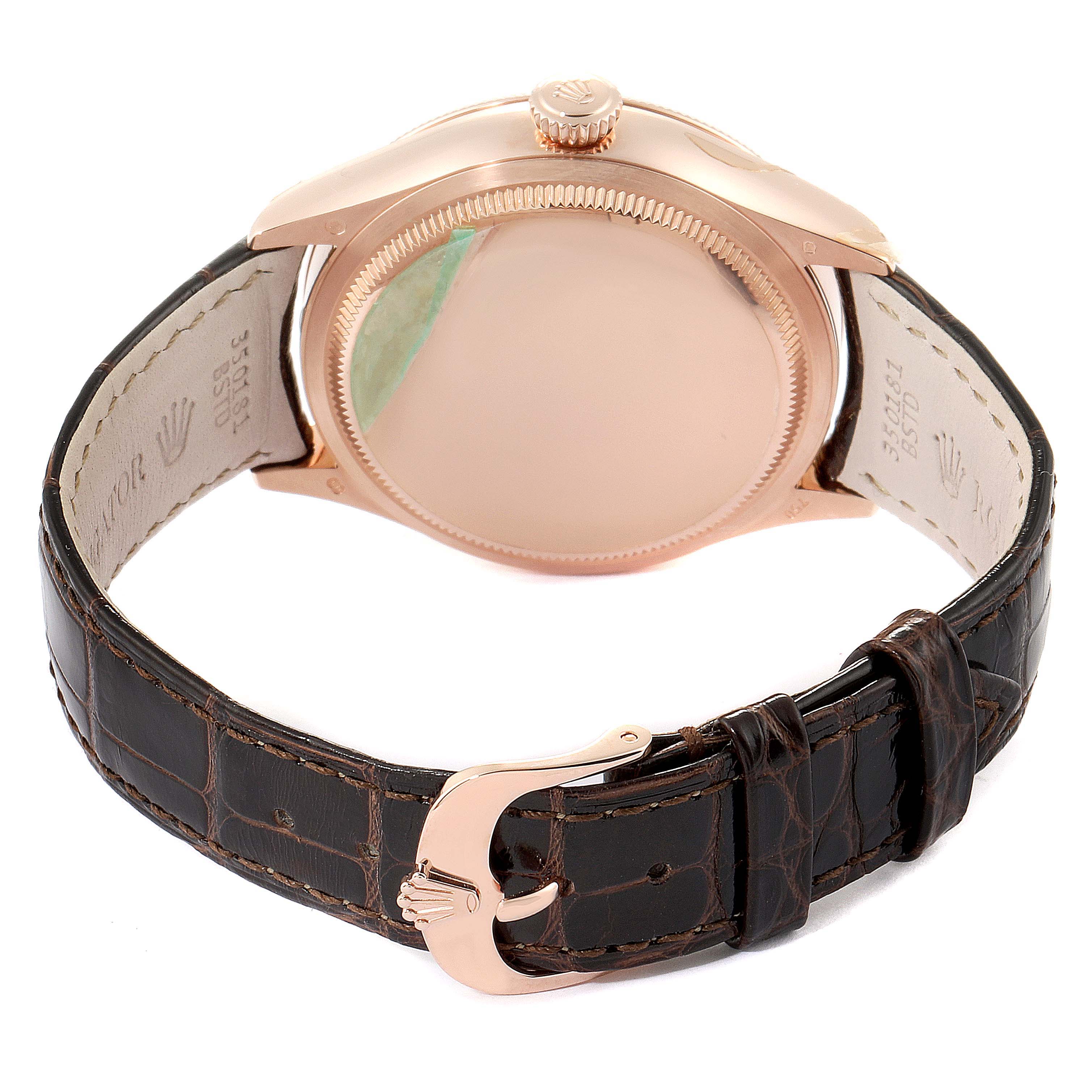 The image shows the back view of a Rolex Cellini 50525 Men
s Rose Gold Silver Dial 50525 Men
s Rose Gold Silver Dial watch, highlighting its case, crown, and leather strap with a branded buckle.