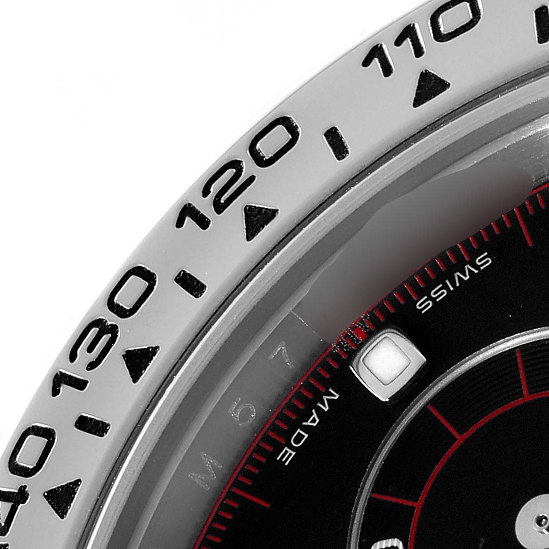 The image shows the bezel and part of the dial of a Rolex Daytona 116509 Men
s White Gold Black Dial 116509 Men
s White Gold Black Dial watch at a close-up angle.
