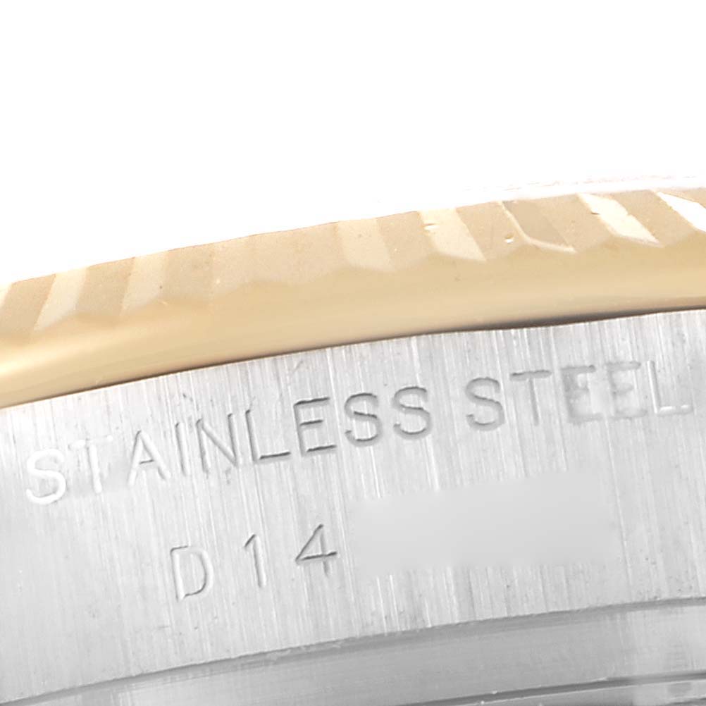 This image shows a close-up view of the side of a Rolex Datejust 179173 Women
s Steel and Gold (two tone) Silver Dial 179173 Women
s Steel and Gold (two tone) Silver Dial watch, highlighting the "Stainless Steel" engraving.