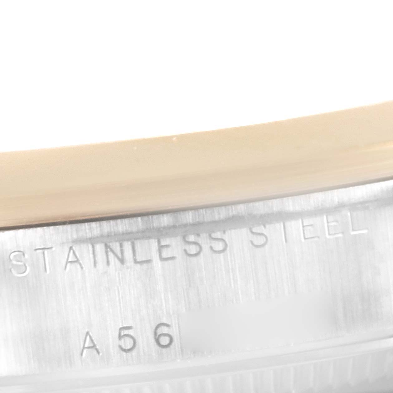 The image shows a close-up of the side case with "STAINLESS STEEL" engraving on the Rolex Mid-Size 78243 Women
s Steel and Gold (two tone) White Dial 78243 Women
s Steel and Gold (two tone) White Dial watch.
