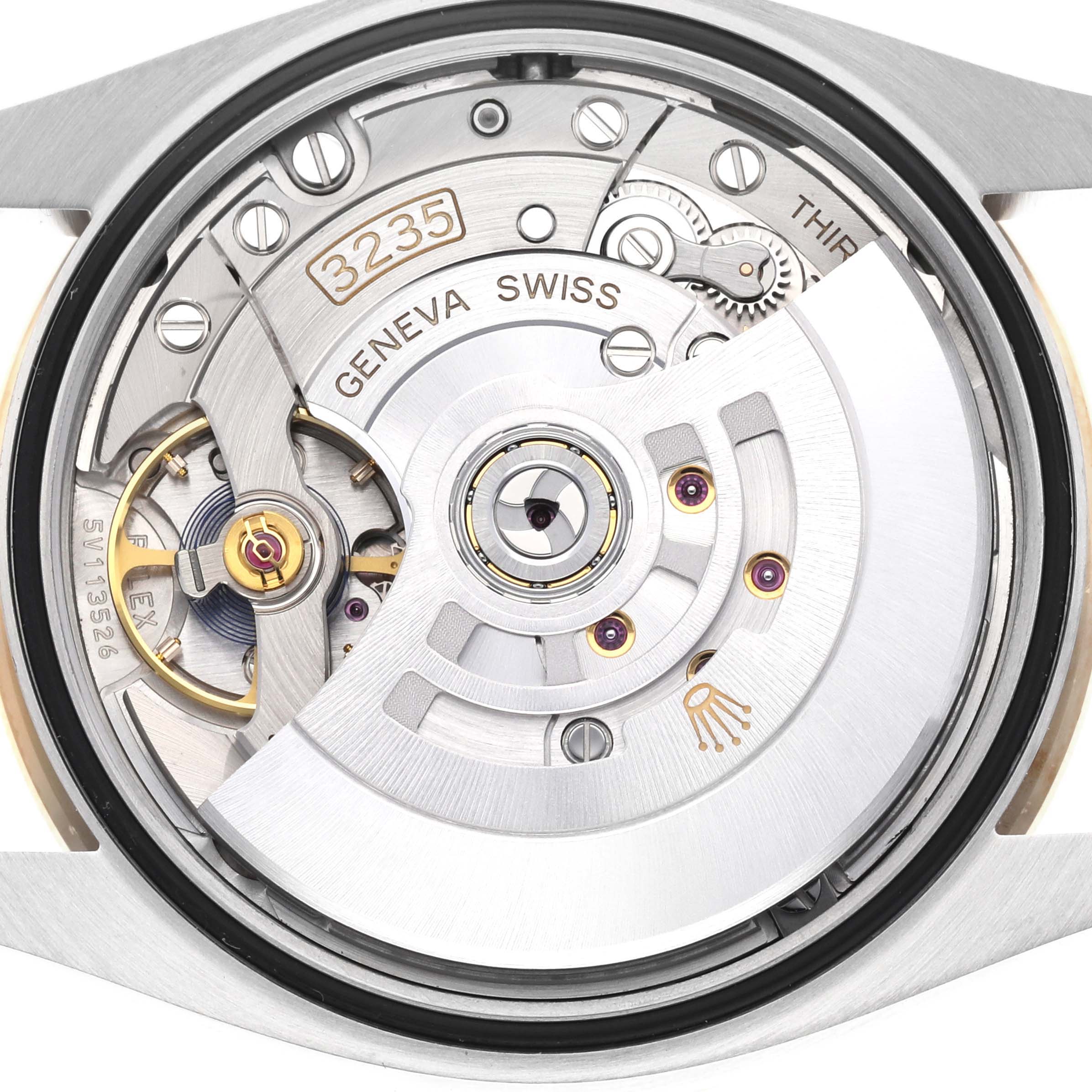 The image shows the back view of the Rolex Datejust 126283 Men's Steel and Gold (two tone) Champagne Dial 126283 Men's Steel and Gold (two tone) Champagne Dial watch, focusing on the intricate movement and mechanics.