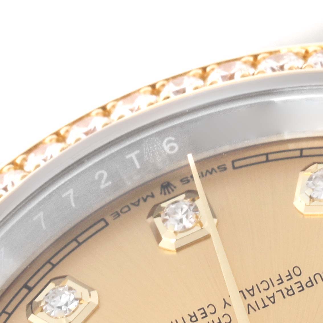 The image shows a close-up of a Rolex Datejust 126283 Men's Steel and Gold (two tone) Champagne Dial 126283 Men's Steel and Gold (two tone) Champagne Dial, highlighting the bejeweled bezel, dial, and part of the hands.