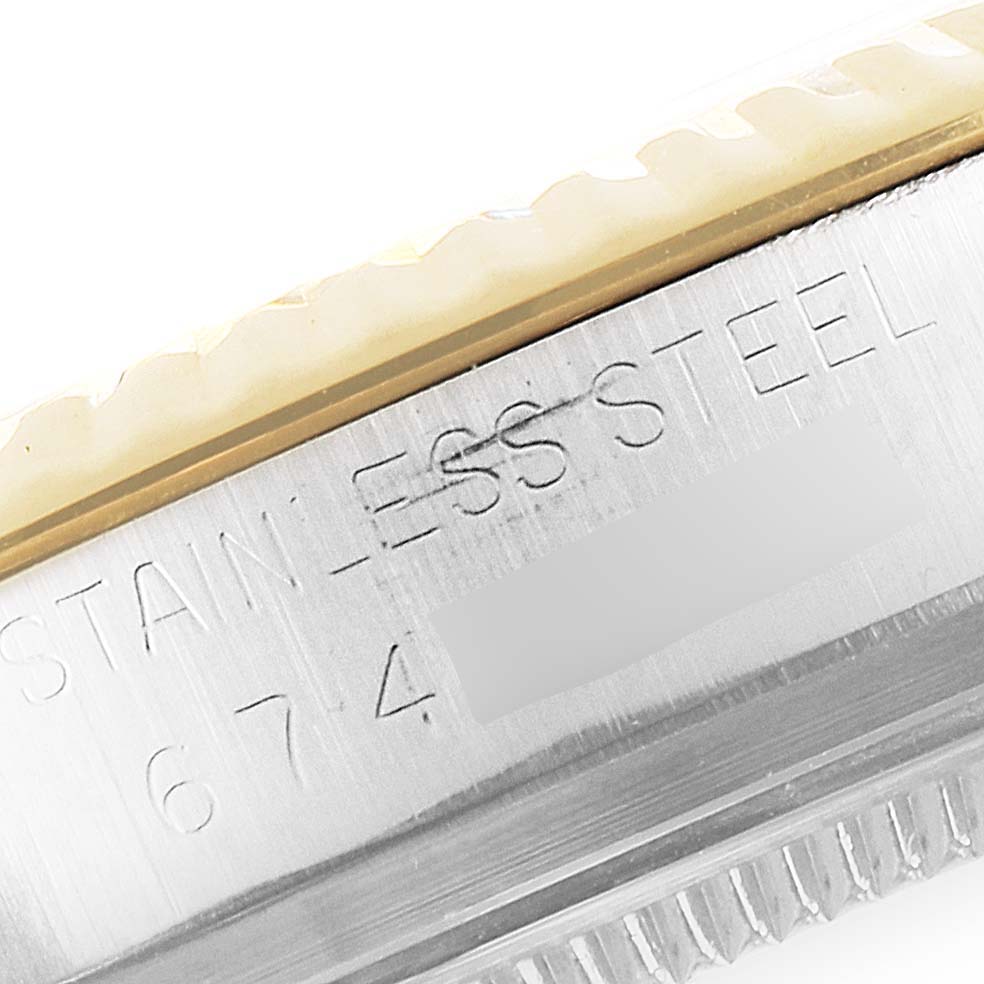 The image shows a close-up view of the case side of a Rolex Vintage Collection 16013 Men's Steel and Gold (two tone) Champagne Dial 16013 Men's Steel and Gold (two tone) Champagne Dial watch, highlighting the stainless steel engraving.