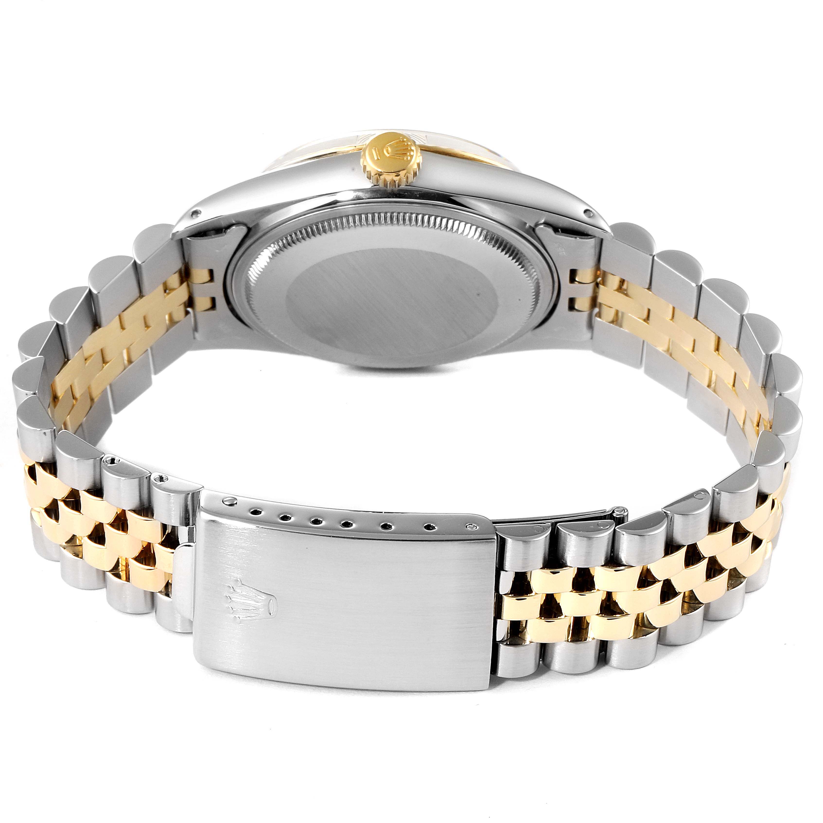 The image shows the back and side view of the Rolex Vintage Collection 16013 Men's Steel and Gold (two tone) Champagne Dial 16013 Men's Steel and Gold (two tone) Champagne Dial watch, featuring its clasp, bracelet, and crown.