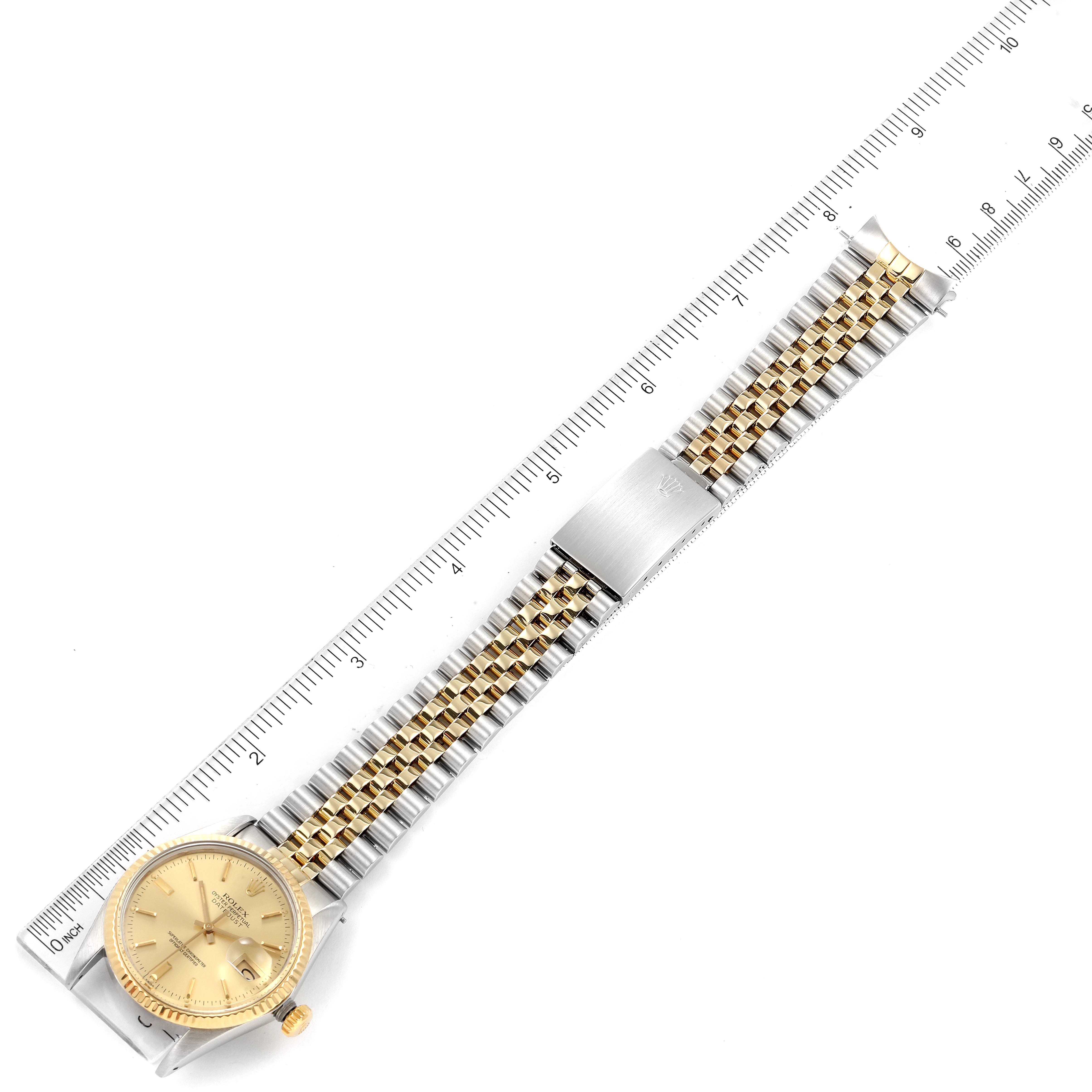 The image shows a Rolex Vintage Collection 16013 Men's Steel and Gold (two tone) Champagne Dial 16013 Men's Steel and Gold (two tone) Champagne Dial watch laid flat, displaying its face, band, and clasp next to a ruler for measurement.