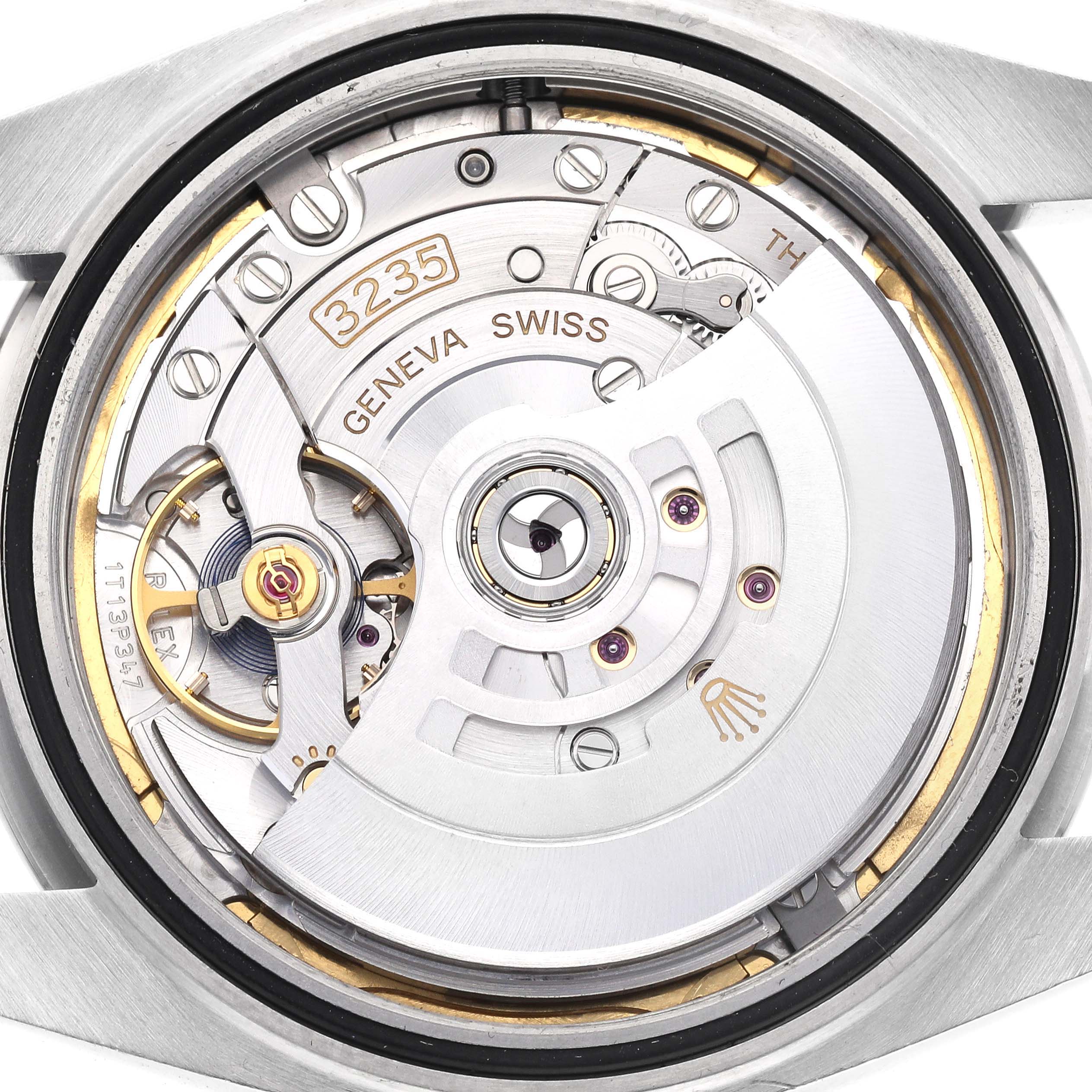 The image shows the inner mechanism of a Rolex Datejust 41 126300 Men
s Stainless Steel Blue Dial 126300 Men
s Stainless Steel Blue Dial, focusing on the movement components.