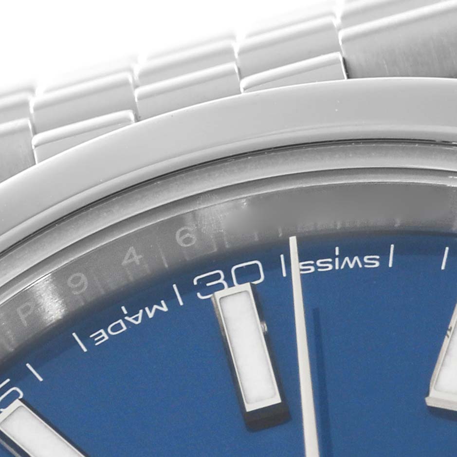 This close-up of the Rolex Datejust 41 126300 Men
s Stainless Steel Blue Dial 126300 Men
s Stainless Steel Blue Dial shows part of the blue dial, markers, minute hand, and part of the stainless steel bracelet.