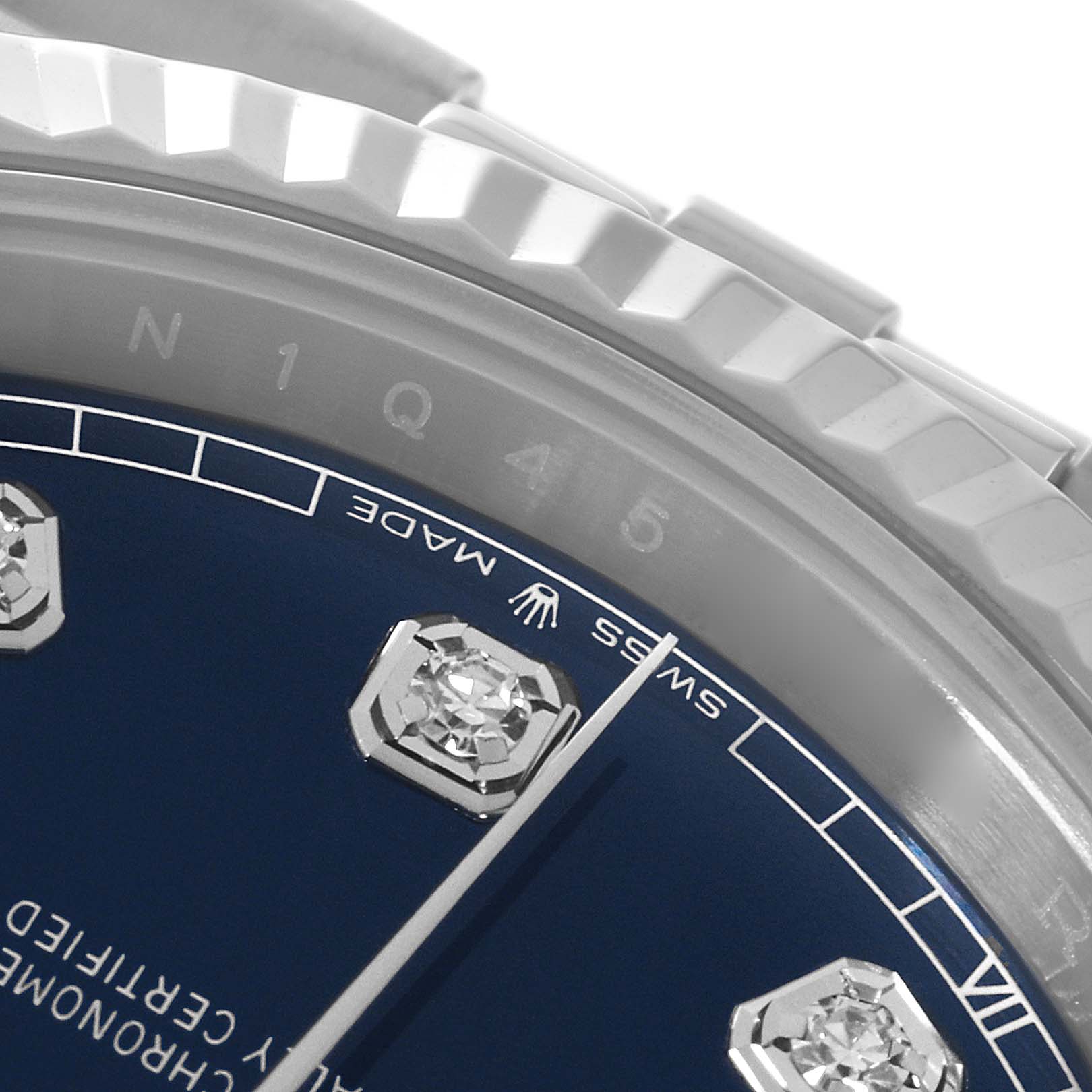 This close-up image of a Rolex Datejust 41 126334 Men's Stainless Steel Blue Dial 126334 Men's Stainless Steel Blue Dial watch shows part of the bezel, dial, and diamond hour markers.