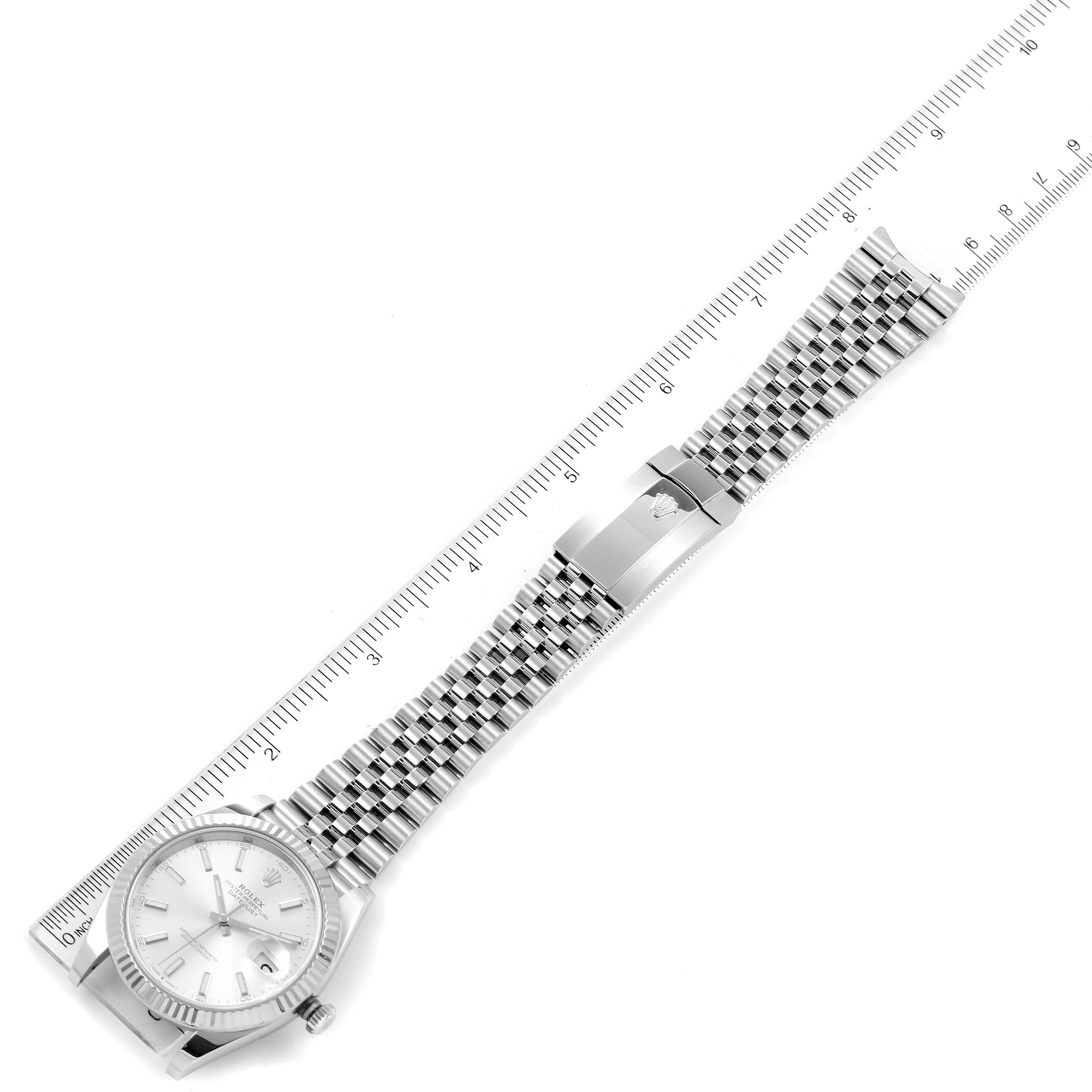 A Datejust 41 Rolex watch is shown flat with its face, bracelet, and clasp, alongside a ruler for measurement.
