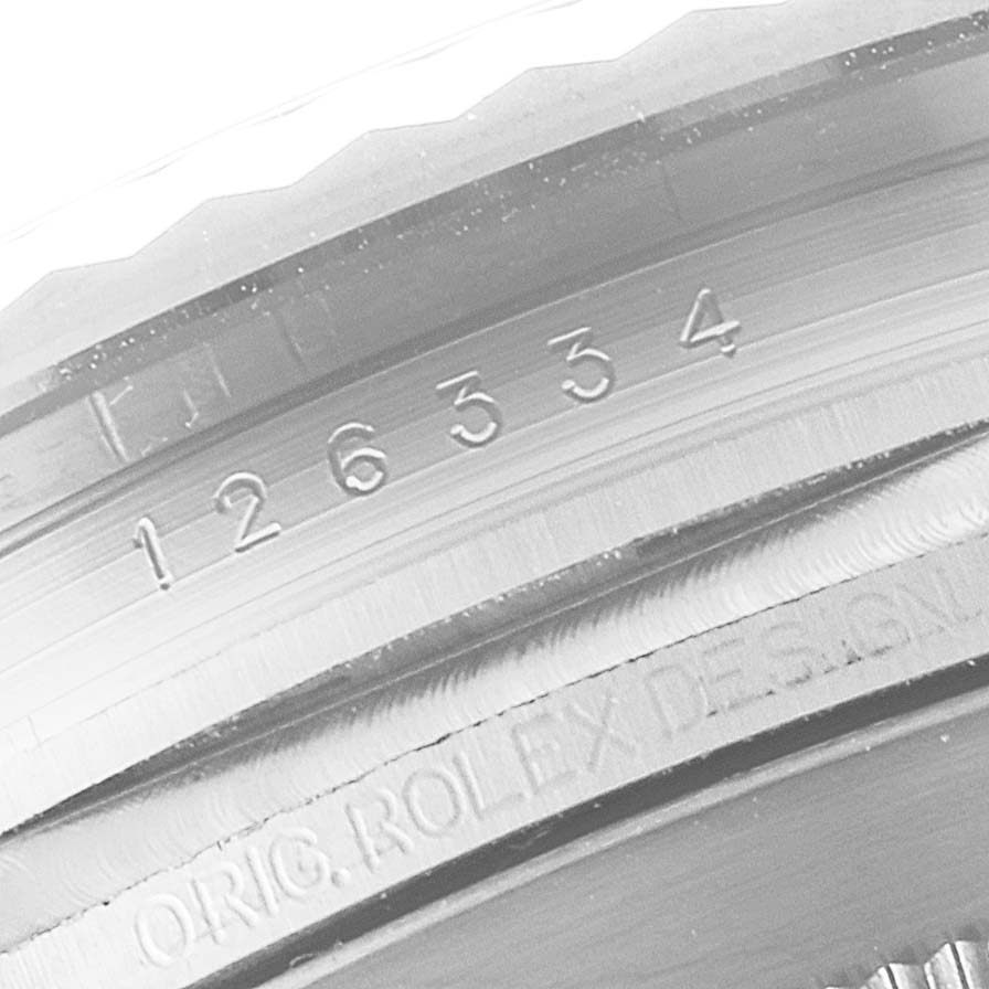 This image shows a close-up of the serial number and design engraving on the inner bezel of a Rolex Datejust 41 126334 Men
s Stainless Steel Silver Dial 126334 Men
s Stainless Steel Silver Dial watch.