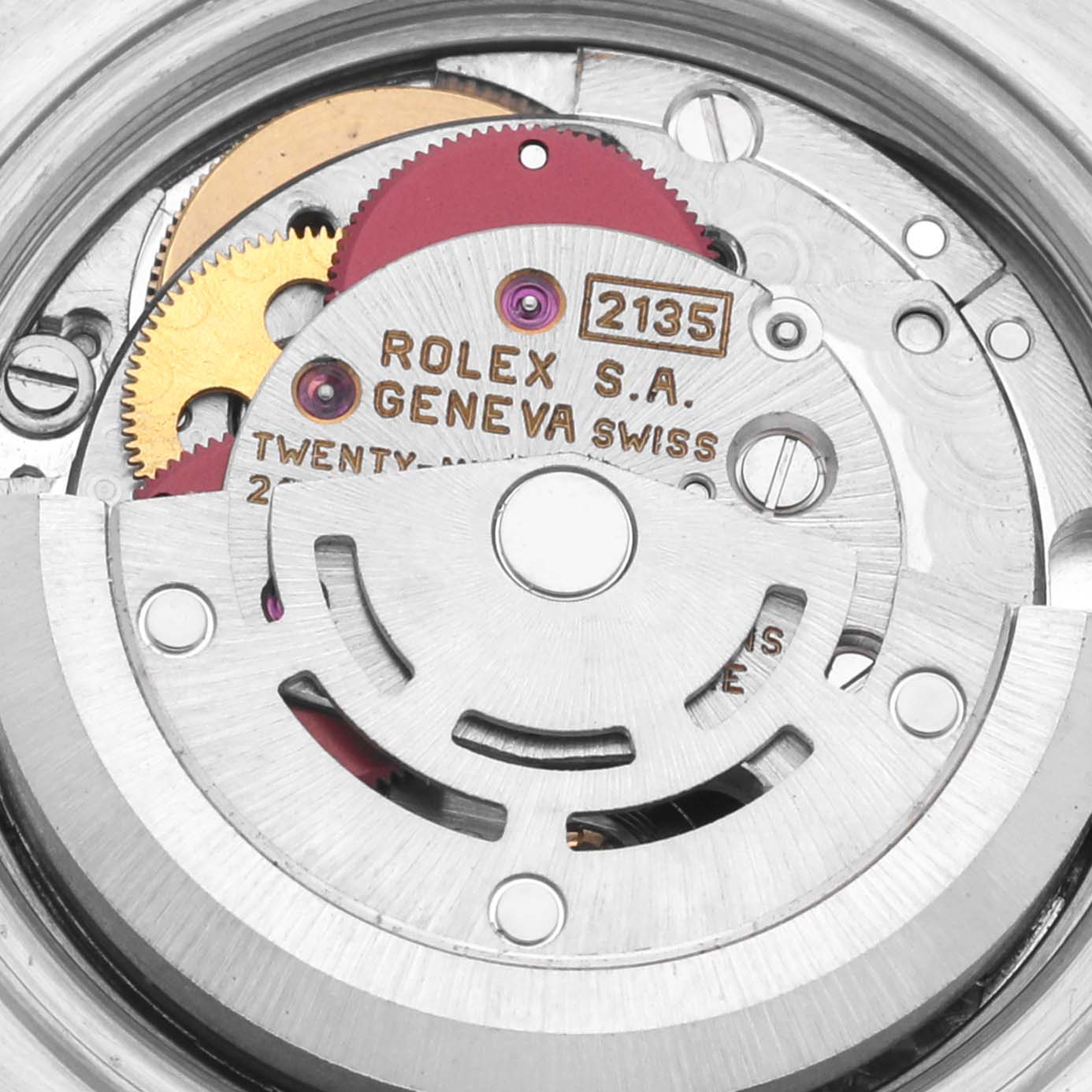 The image shows the movement of a Rolex Datejust 69173 Women
s Steel and Gold (two tone) Champagne Dial 69173 Women
s Steel and Gold (two tone) Champagne Dial, highlighting gears and inscriptions from a top-down angle.