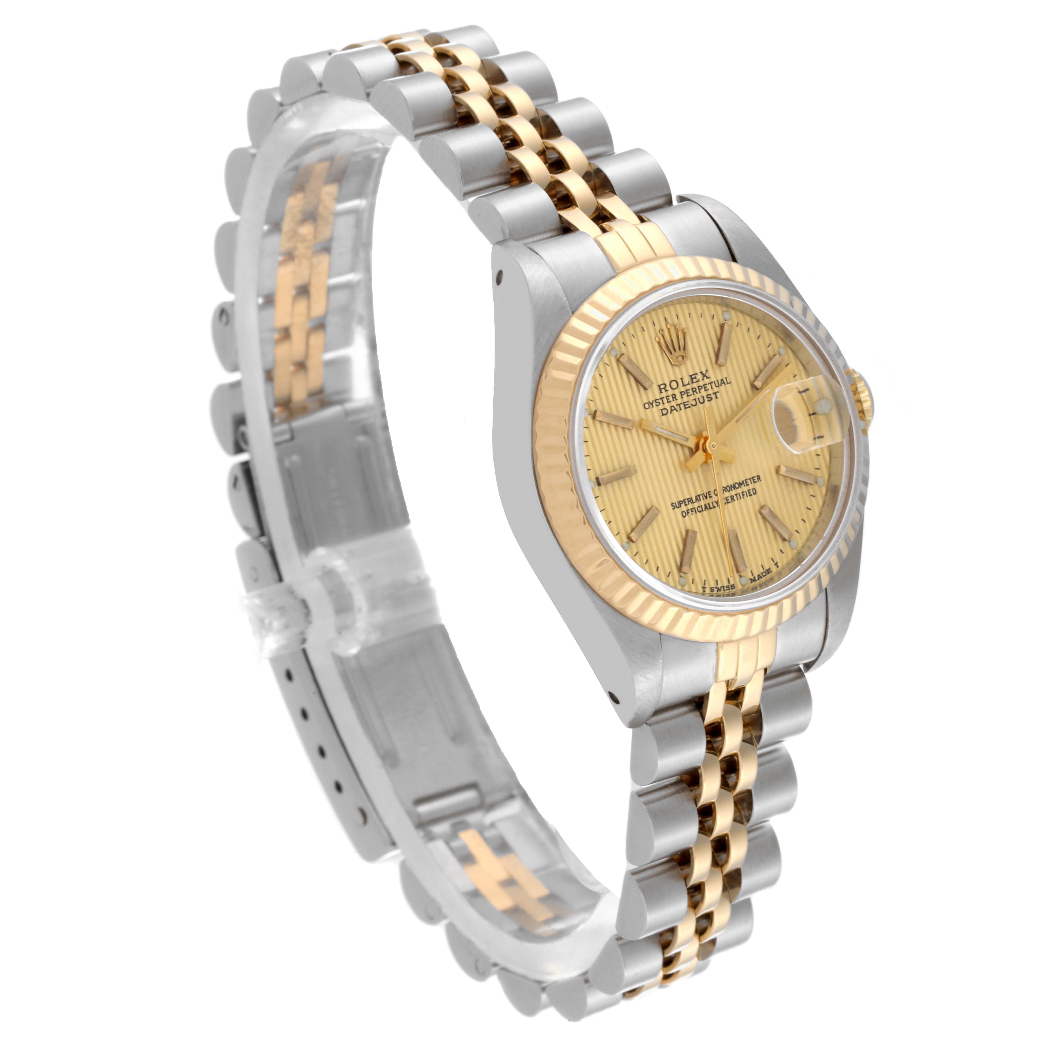 The Rolex Datejust 69173 Women
s Steel and Gold (two tone) Champagne Dial 69173 Women
s Steel and Gold (two tone) Champagne Dial watch is shown in a side angle, featuring the dial, fluted bezel, and jubilee bracelet.