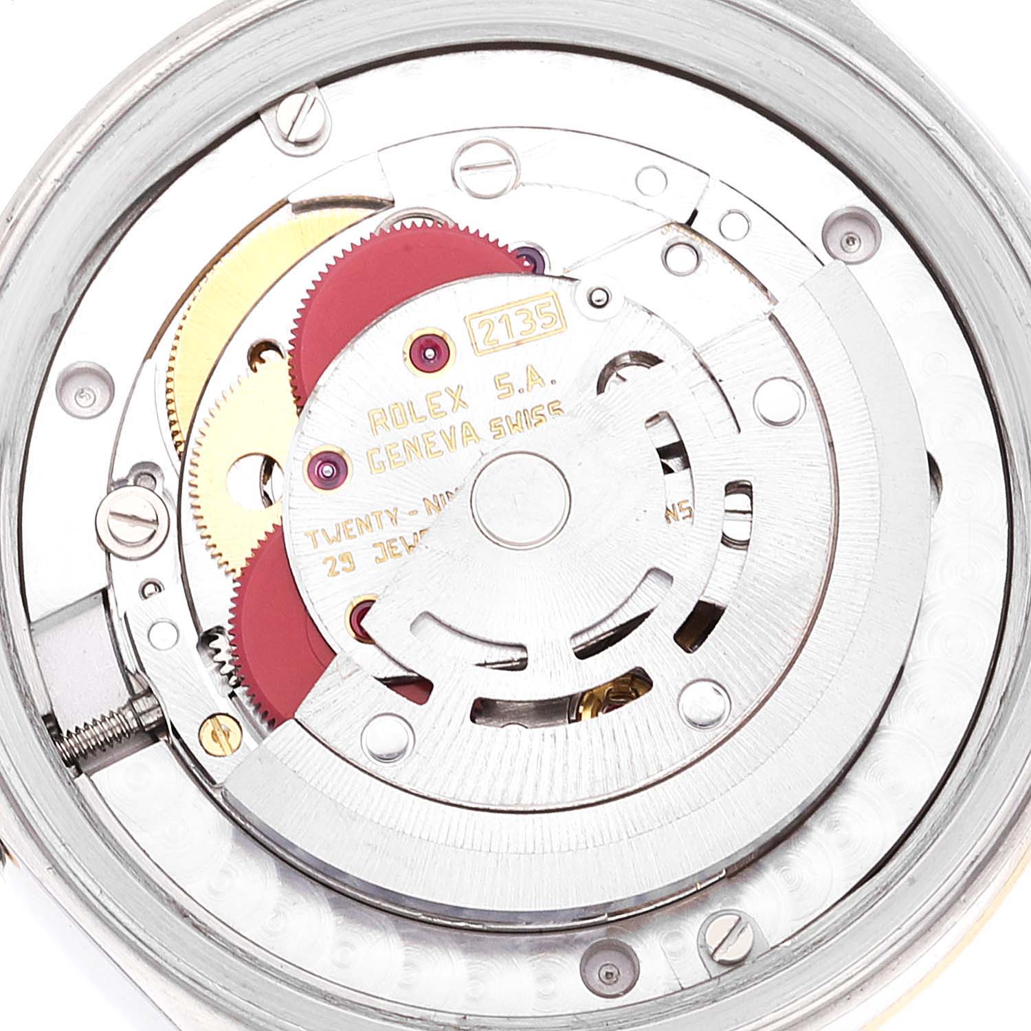 The image shows a close-up, detailed view of the movement inside a Rolex Mid-Size 68273 Women
s Steel and Gold (two tone) Champagne Dial 68273 Women
s Steel and Gold (two tone) Champagne Dial model, showcasing the gears and internal components.